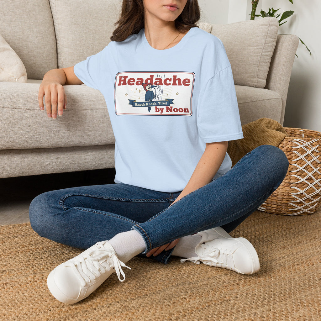 Light blue nurse humor T-shirt with “Headache by Noon” front graphic