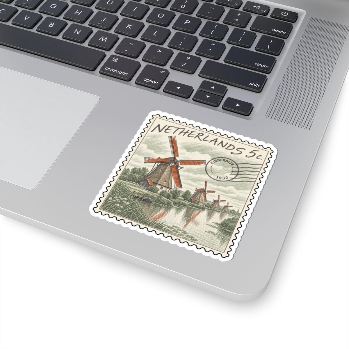 Netherlands 5c stamp sticker with red windmill, riverside landscape, and scalloped outline