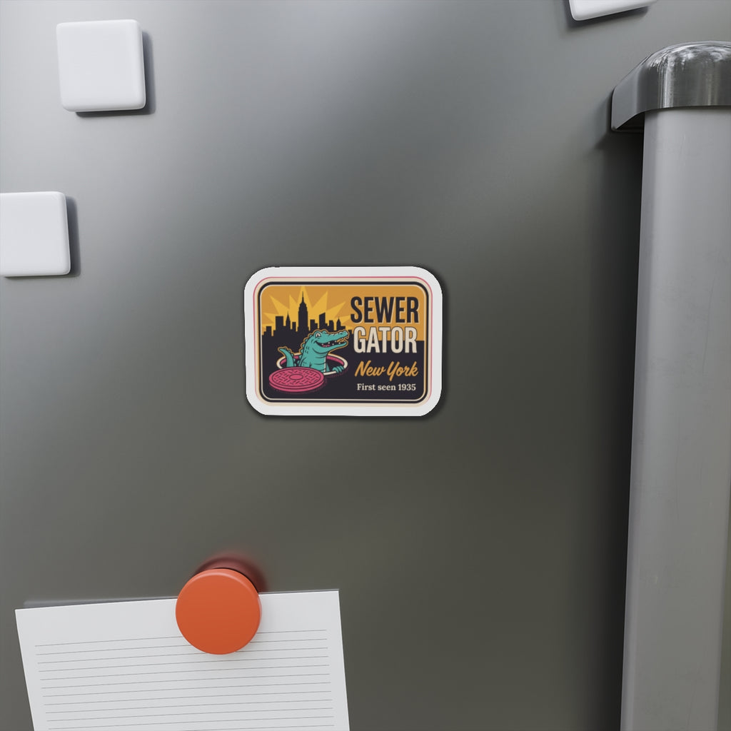 Die-cut refrigerator magnet on stainless fridge door with Sewer Gator New York artwork.