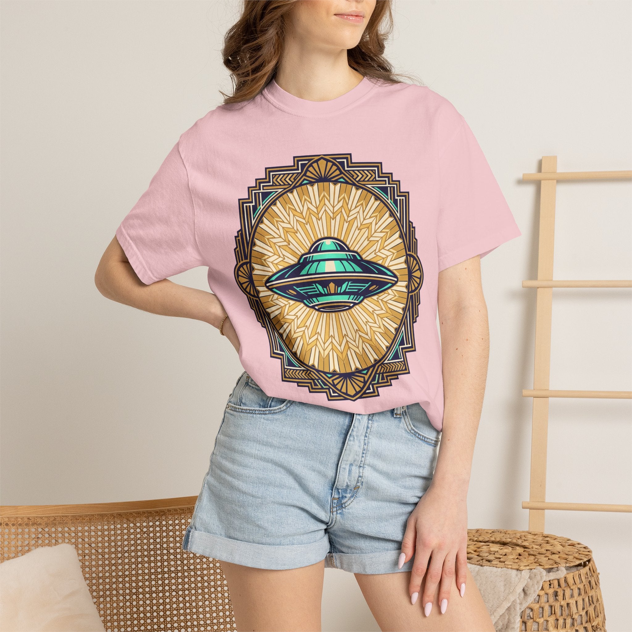 Pink UFO graphic T-shirt with teal flying saucer emblem