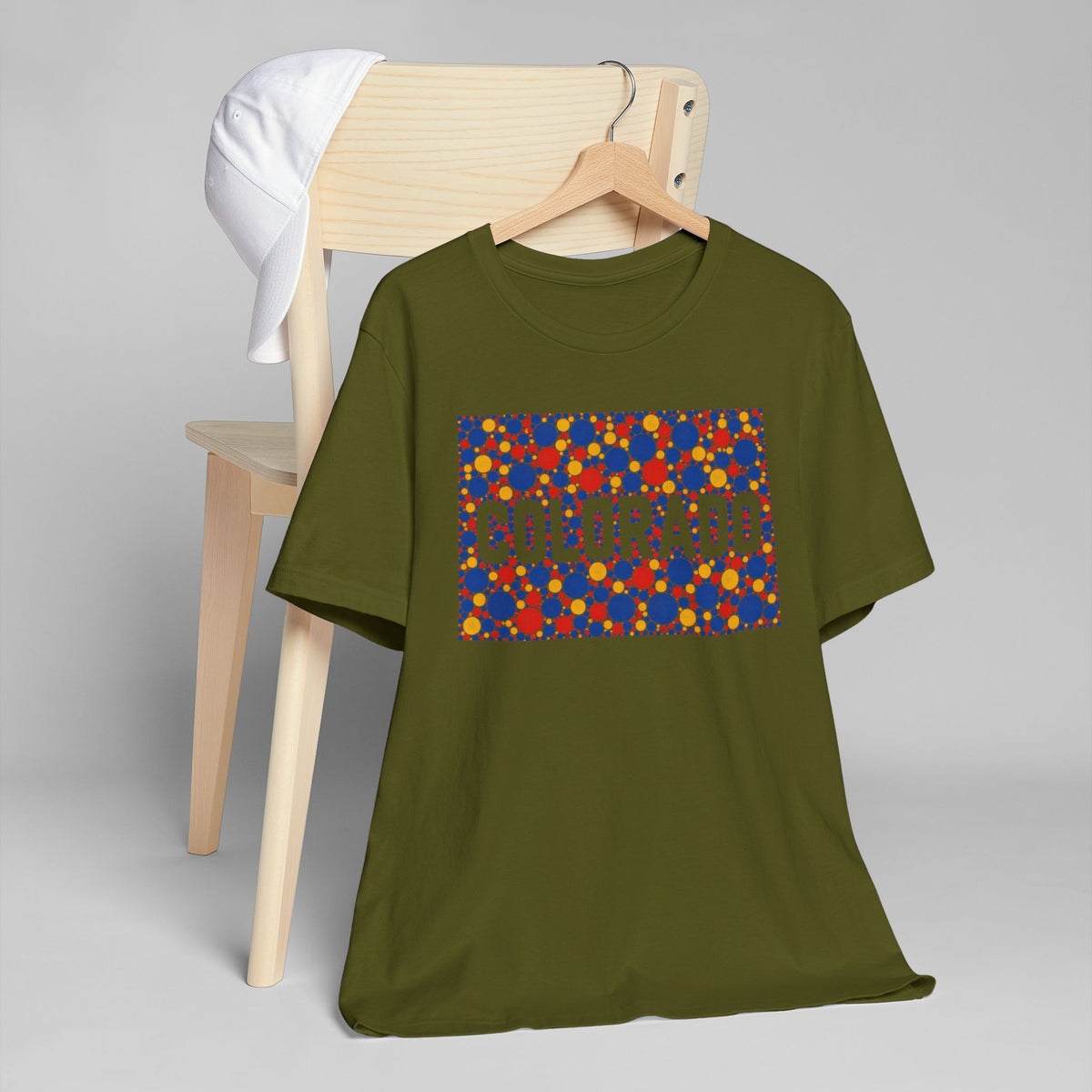 Olive green crewneck T-shirt with colorful patterned rectangle graphic on the chest