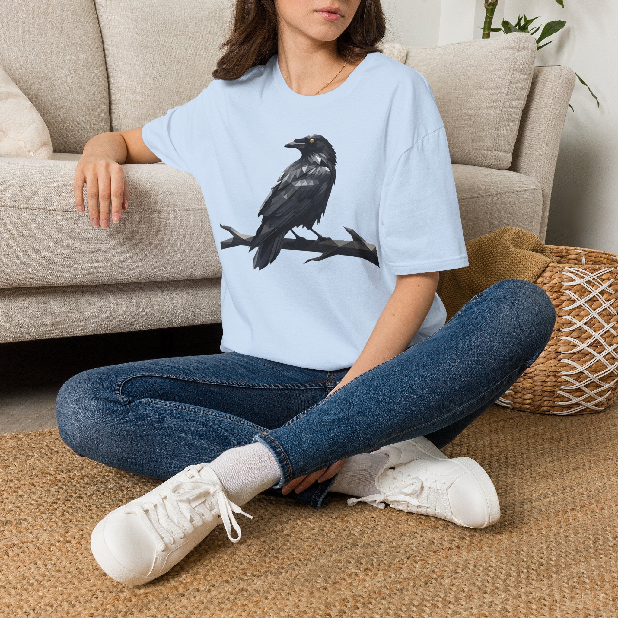 Light blue raven bird graphic T-shirt on model, short sleeves, front design
