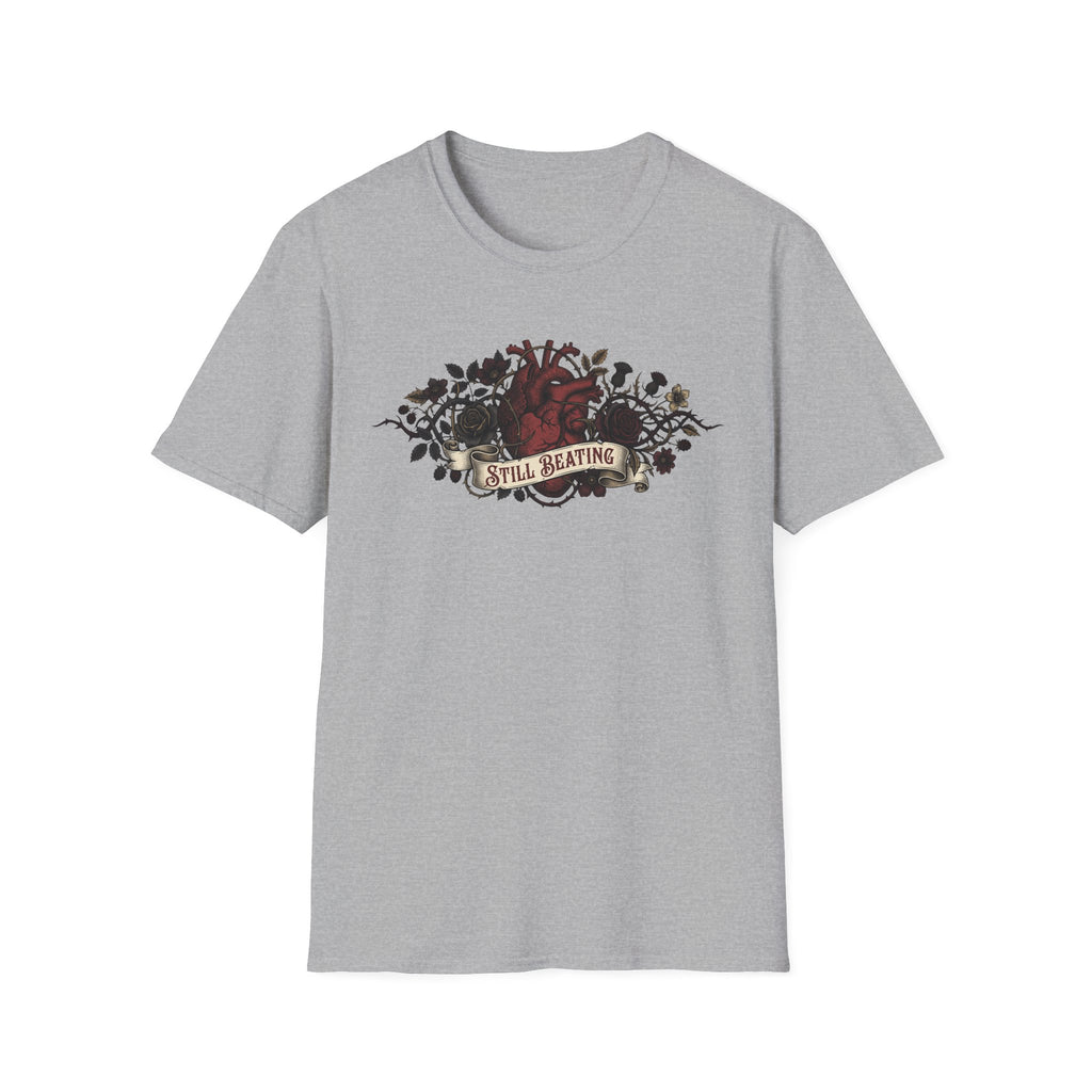 Heather gray T-shirt featuring a gothic floral anatomical heart graphic with “Still Beating”
