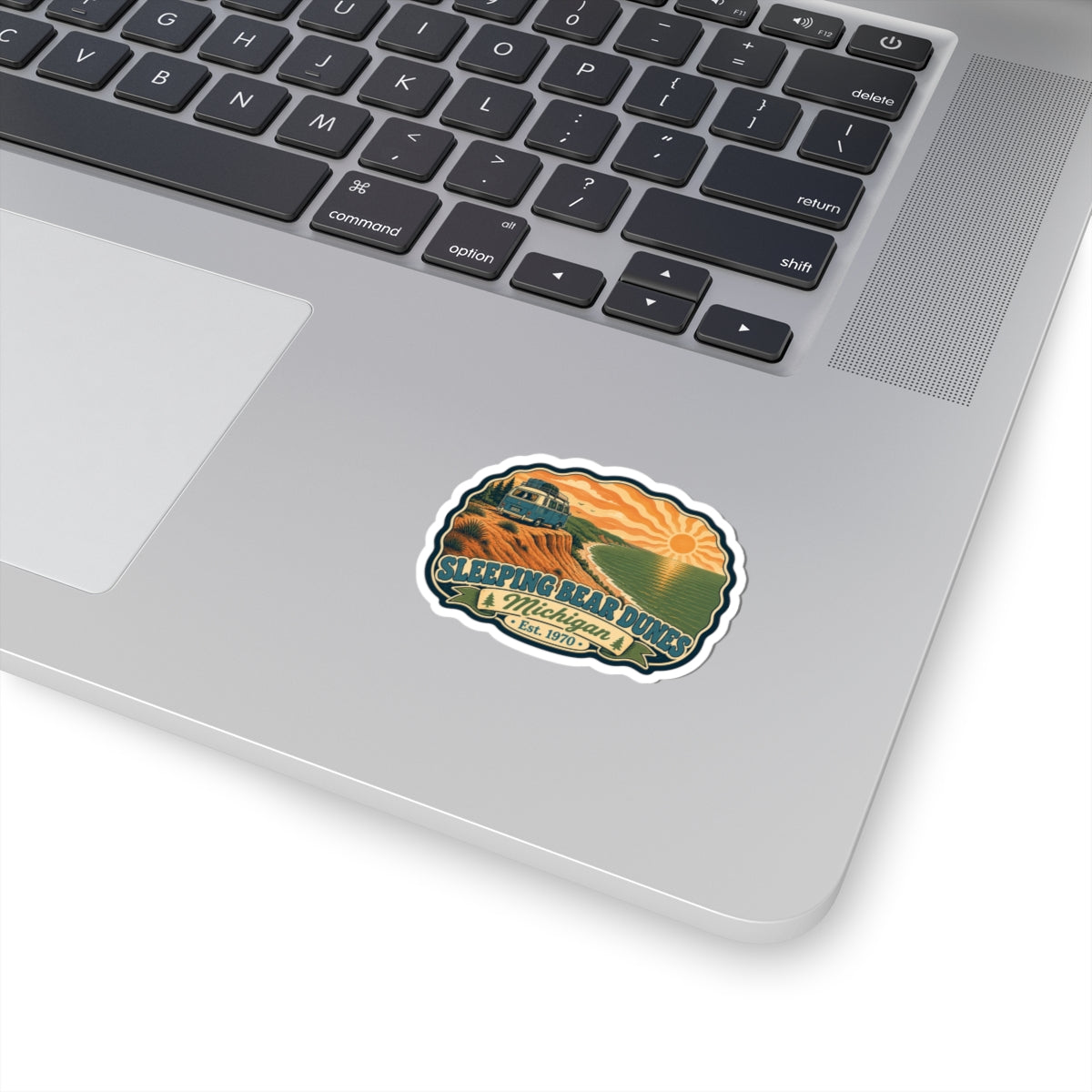 Round multicolor sticker with Sleeping Bear Dunes emblem, mountain, lake, and text border