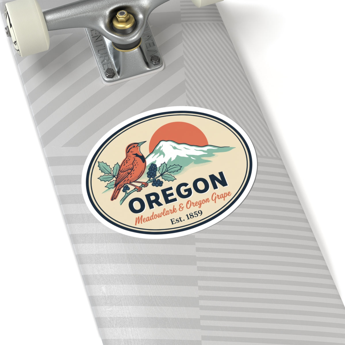 Oval Oregon state badge sticker on a gray envelope, featuring meadowlark, grapes, mountains.