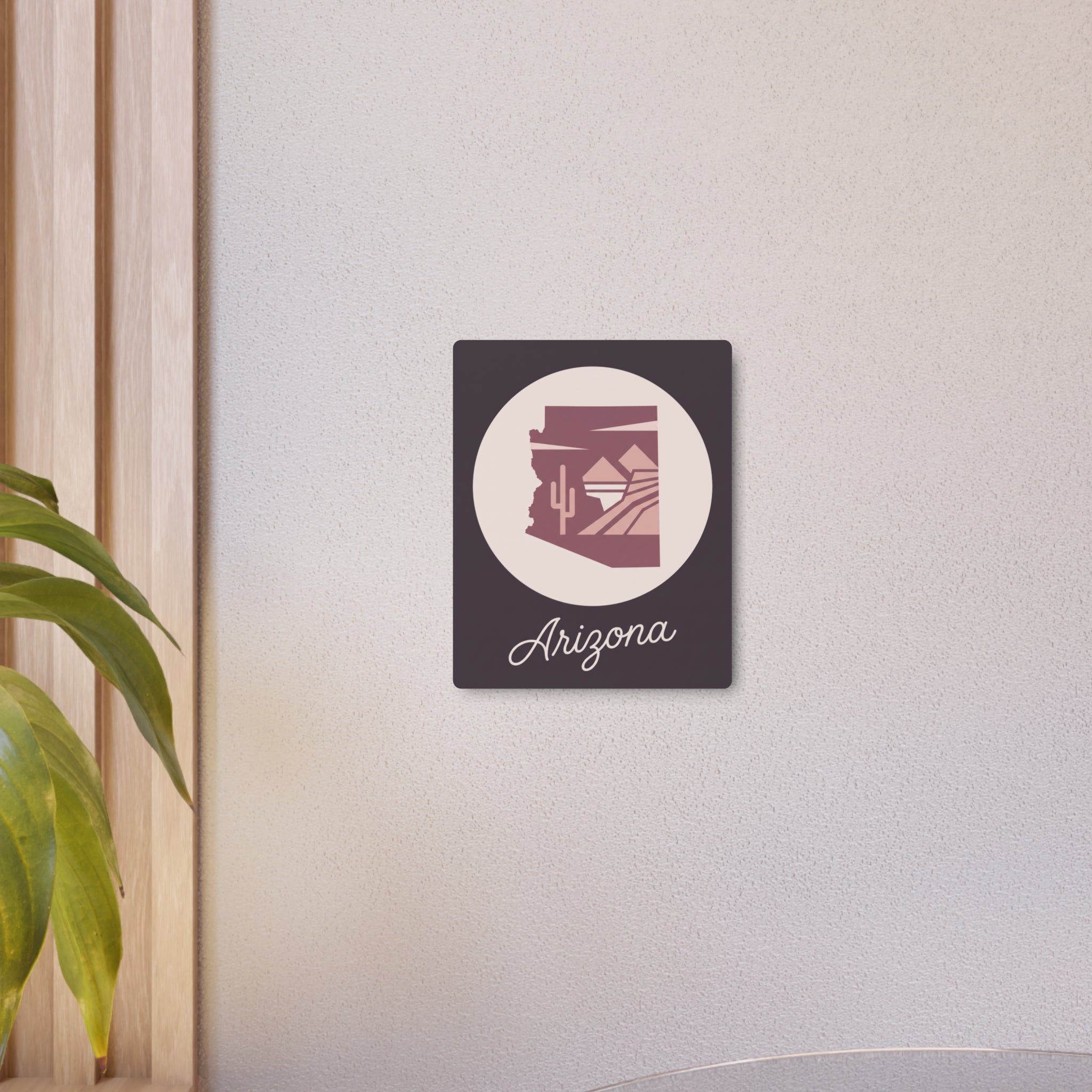 Mauve metal wall art square featuring a circular desert emblem and cursive 'Arizona'
