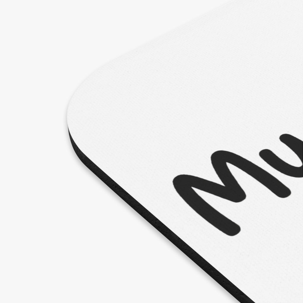 Rectangle mouse pad corner with bold black “Mom” text on light surface