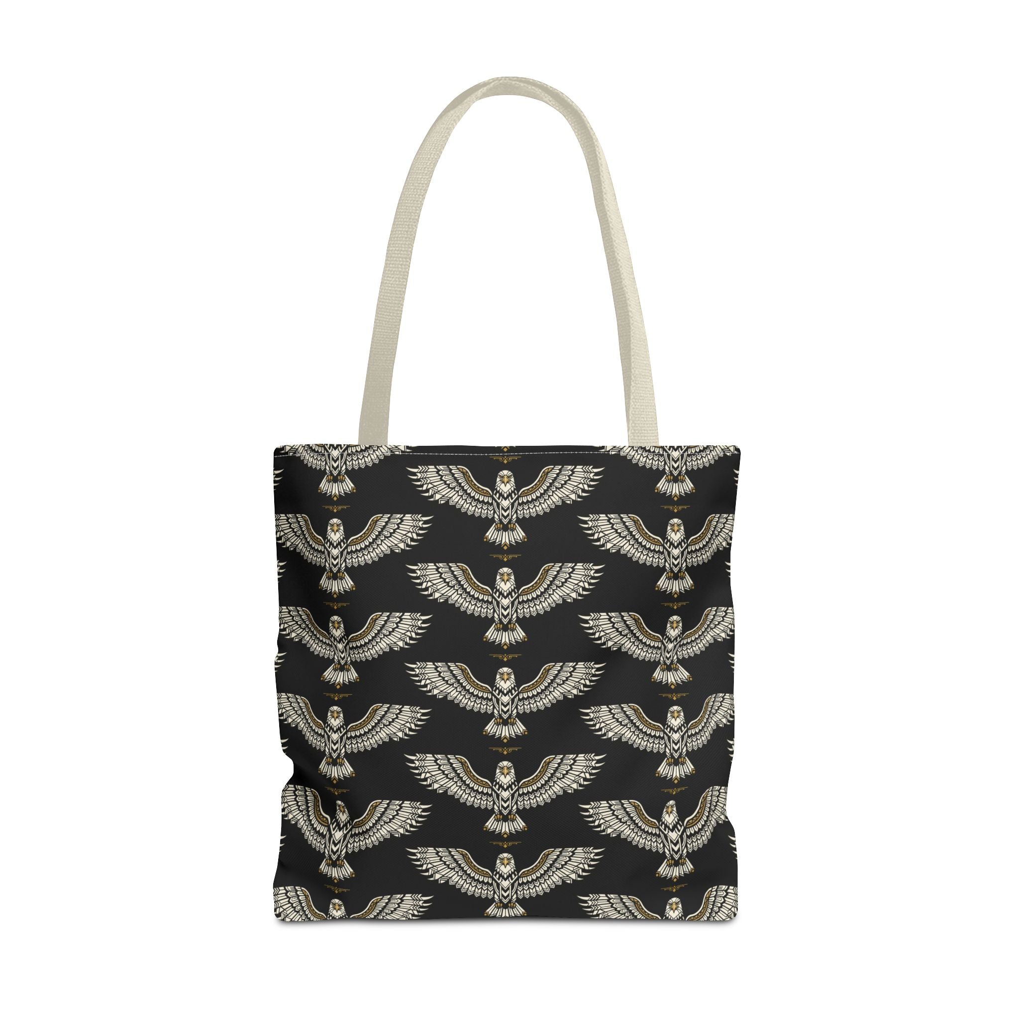 Tote bag with winged scarab pattern in gold on black, cream handles