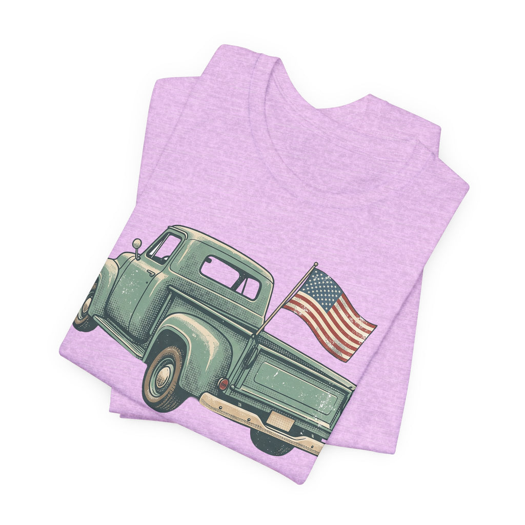 Lavender/pink T-shirt with vintage green pickup truck graphic and American flag.