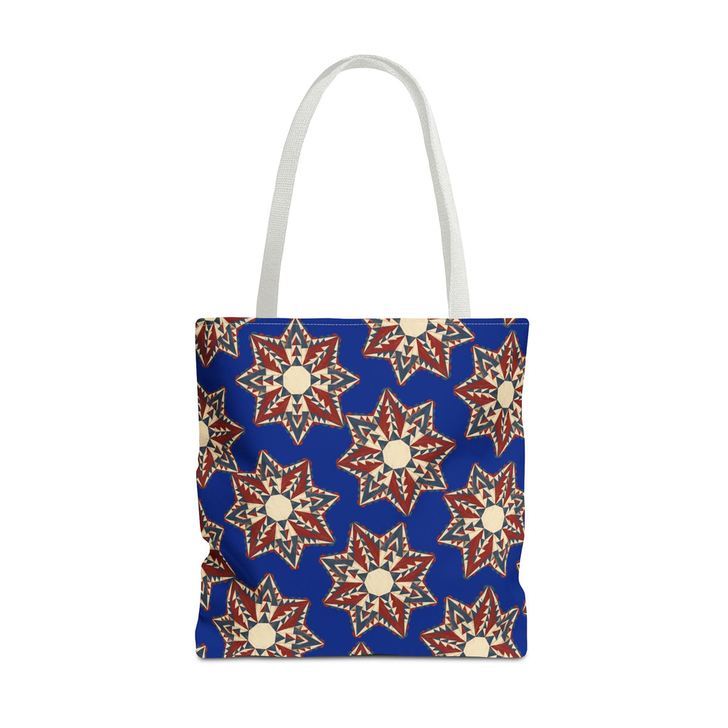 Blue tote bag with starburst floral pattern and pale gray handles