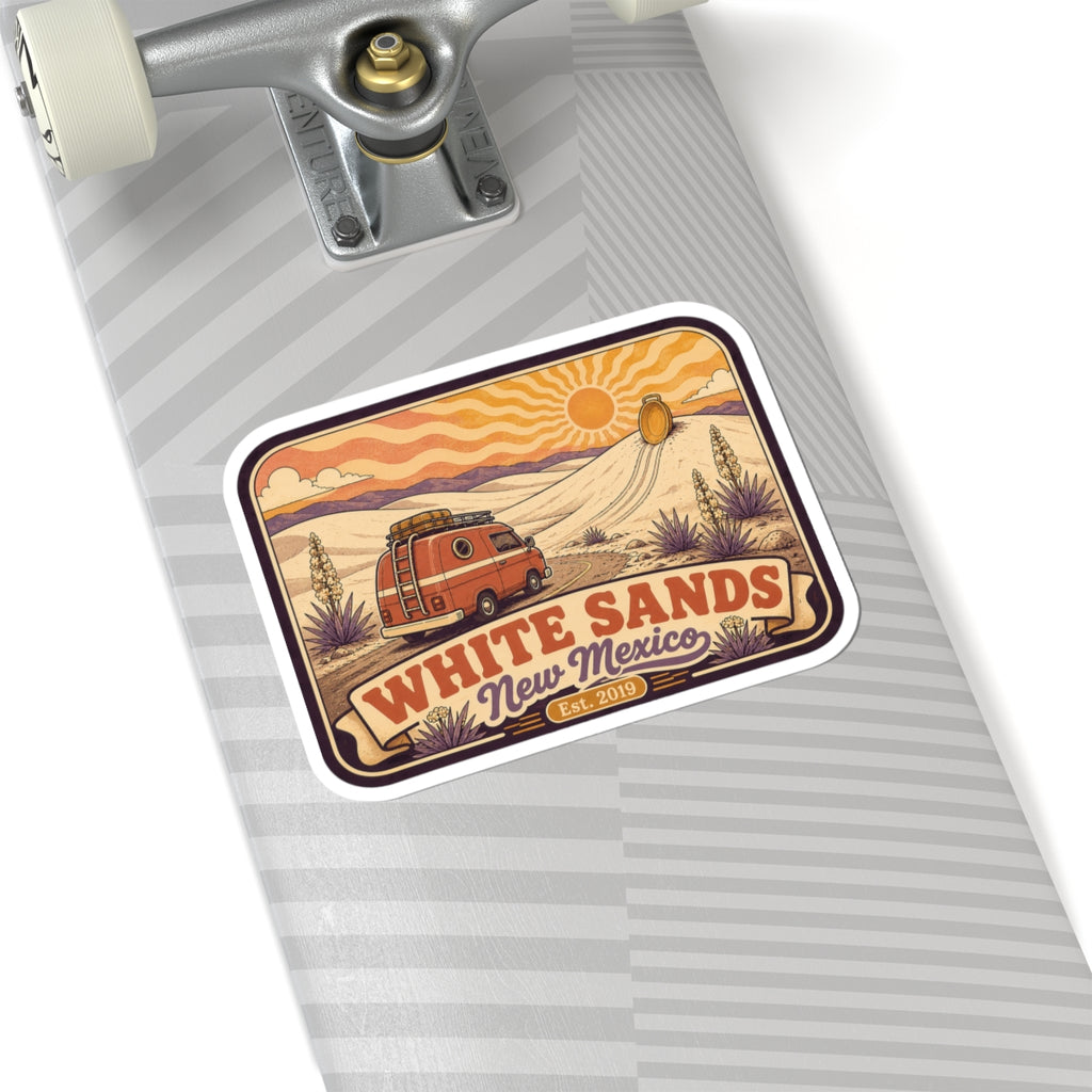 White Sands kiss-cut vinyl sticker on a striped luggage tag, with retro van, dunes, sun, and “Est. 2019”