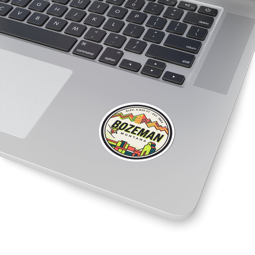 Round sticker with multicolor mountain and retro town logo inside white border