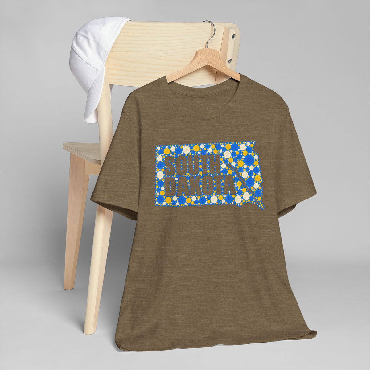 Brown crew-neck t-shirt with blue and yellow South Dakota map graphic on front.