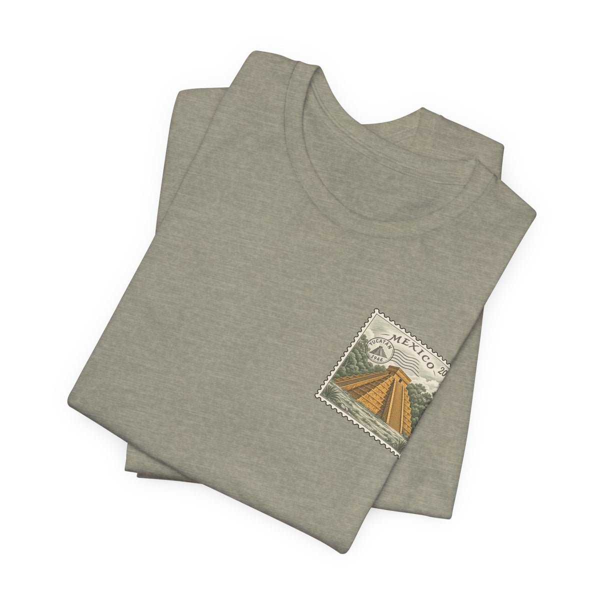 Olive green crew-neck t-shirt with small vintage Mexico postage-stamp graphic, folded pair.