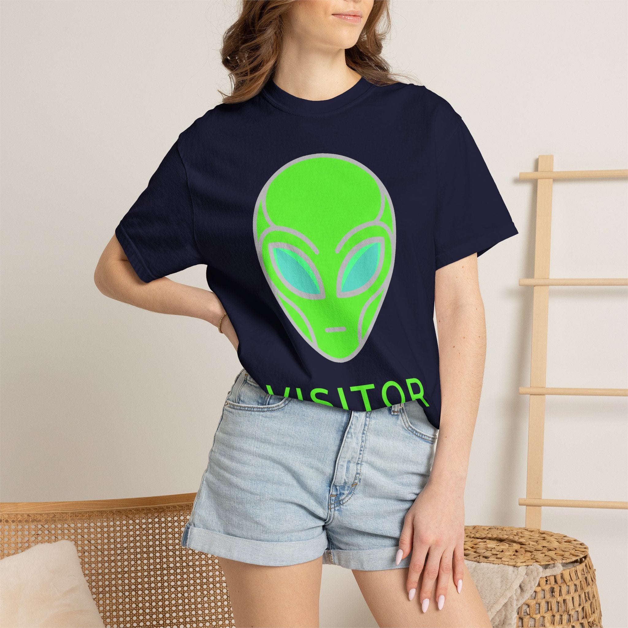 Navy alien visitor T-shirt with neon green alien face graphic, crew neck