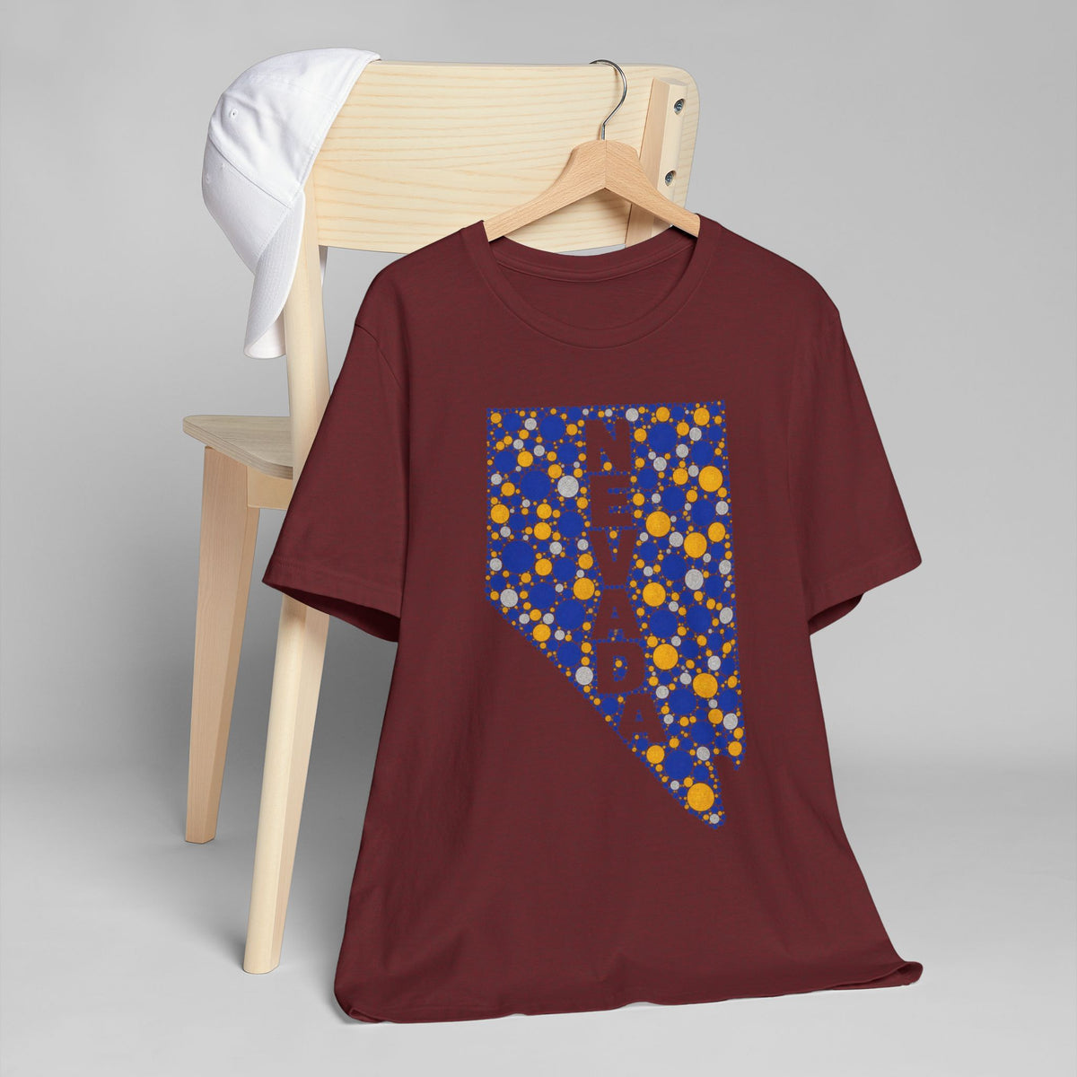 Maroon short-sleeve t-shirt with blue and gold Nevada map graphic