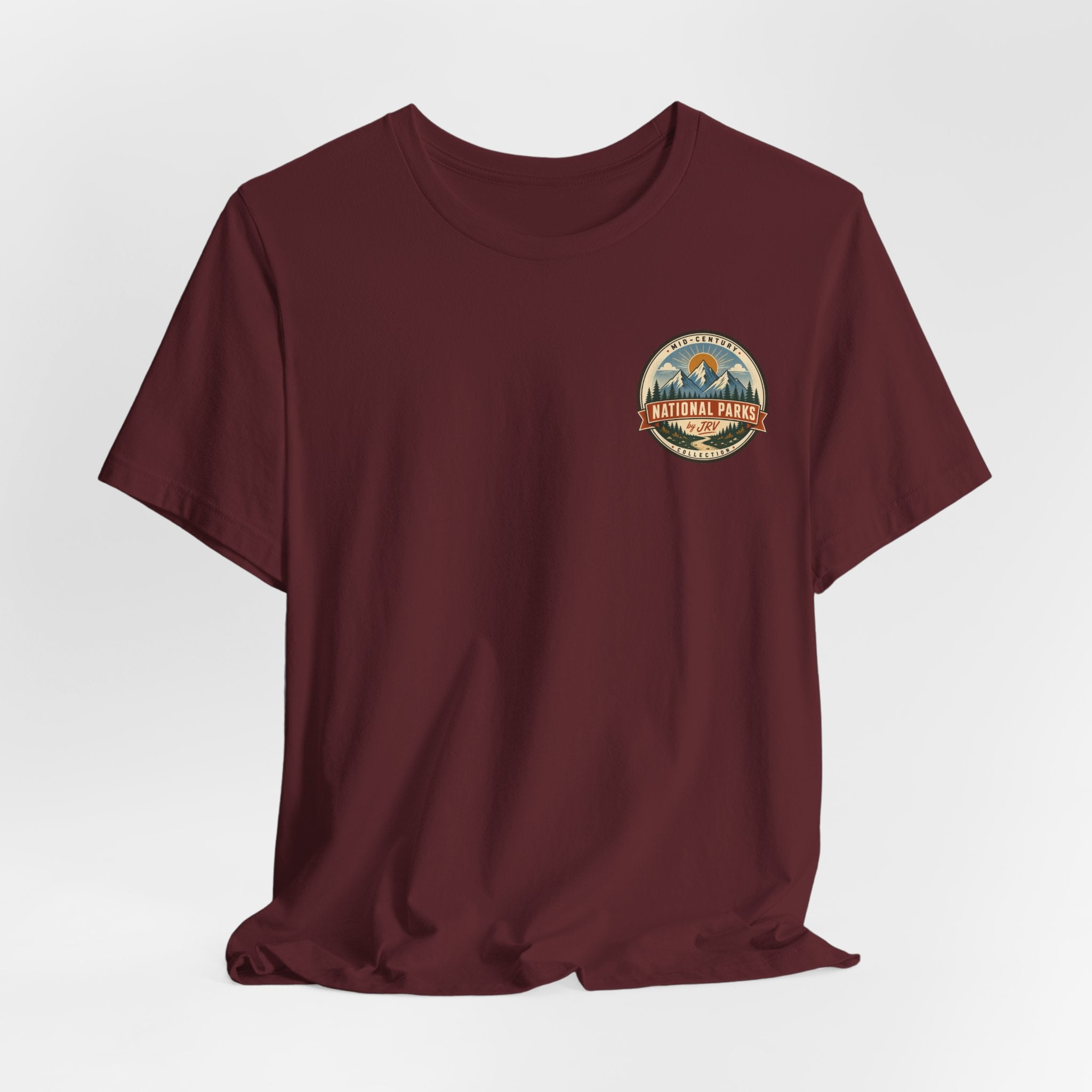 Burgundy T-shirt with small National Park badge graphic on left chest
