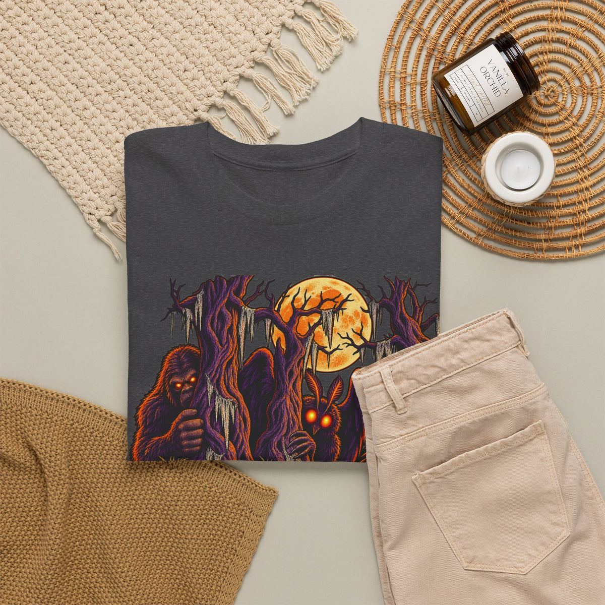 Dark heather crewneck t-shirt with monster and orange moon graphic on front