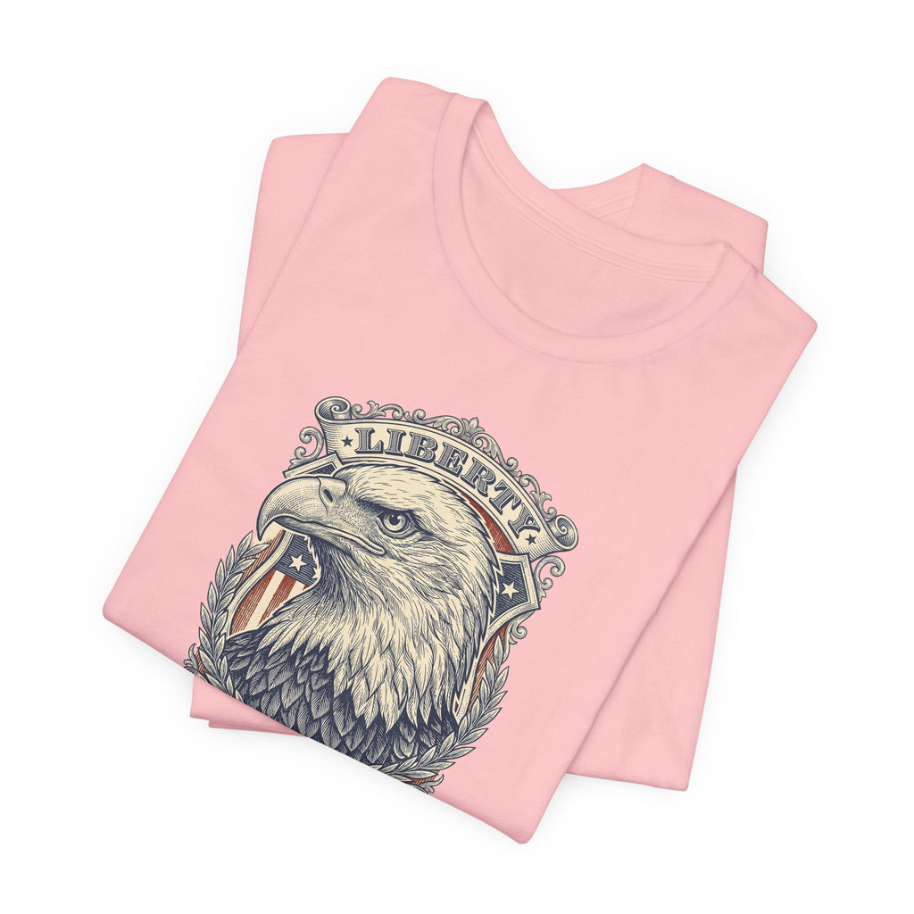 Light pink T-shirt with eagle head graphic and laurel wreath on the chest