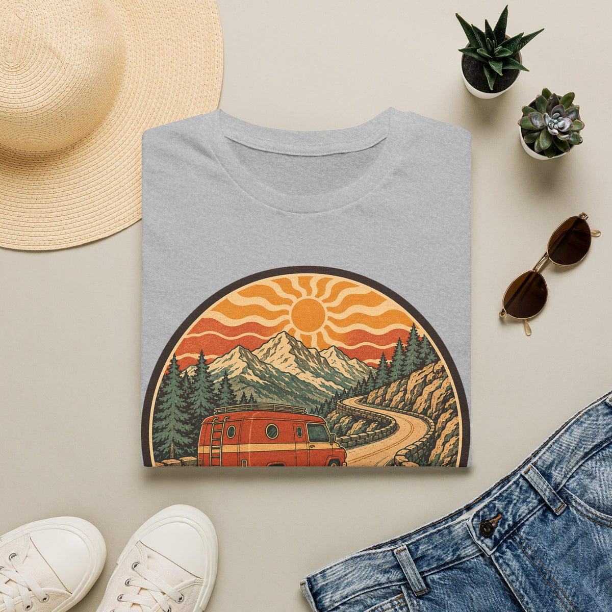 Unisex T-shirt in light gray with crew neck and mountain sunset van graphic on front.