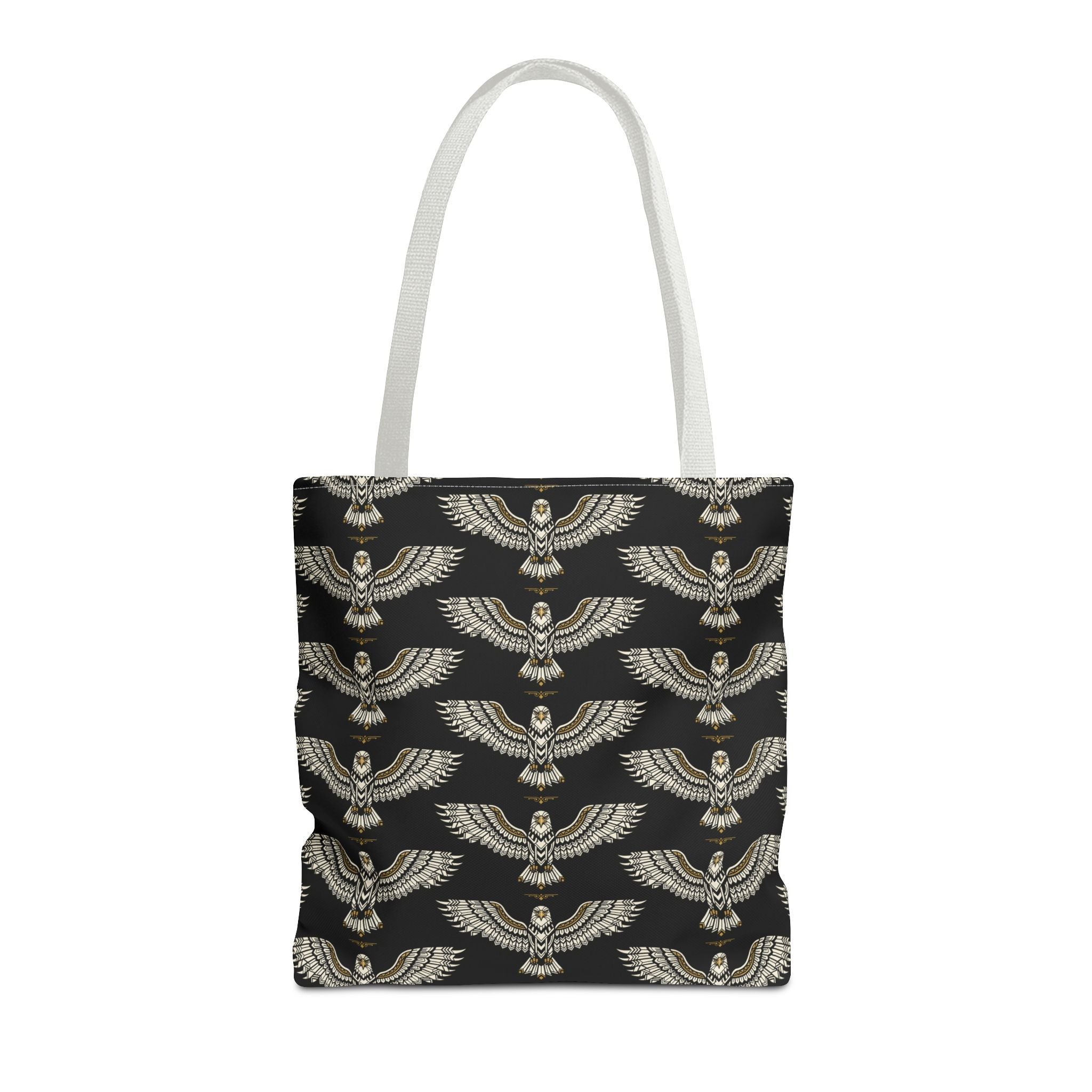 Tote bag with winged scarab pattern, black fabric and gold emblems, cream handles