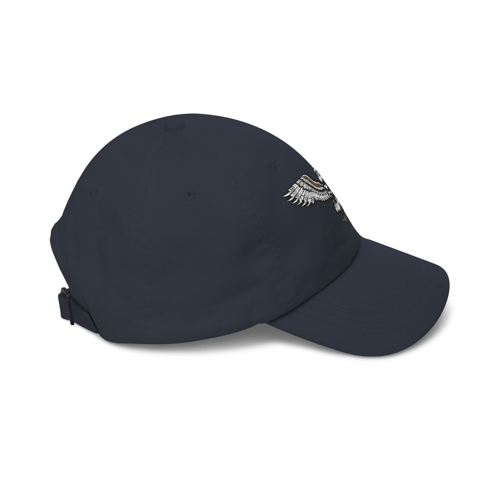 Navy baseball cap angled with embroidered eagle patch near front panel
