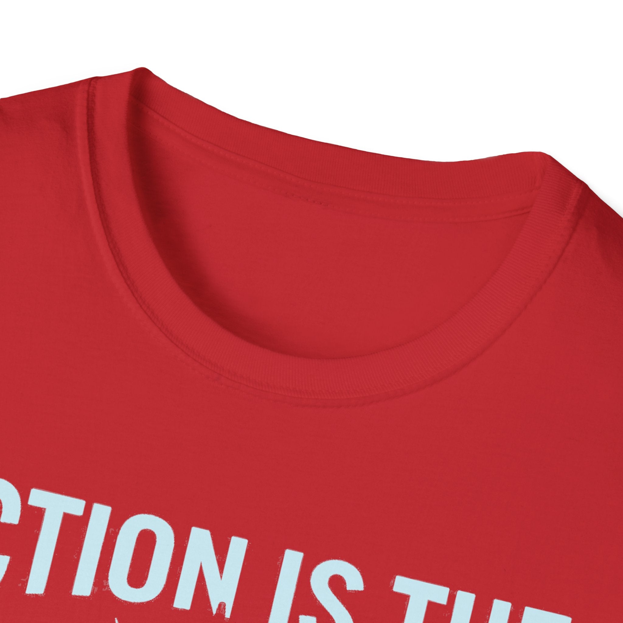 Red T-shirt close-up, crew neck with motivational quote text print (partial)