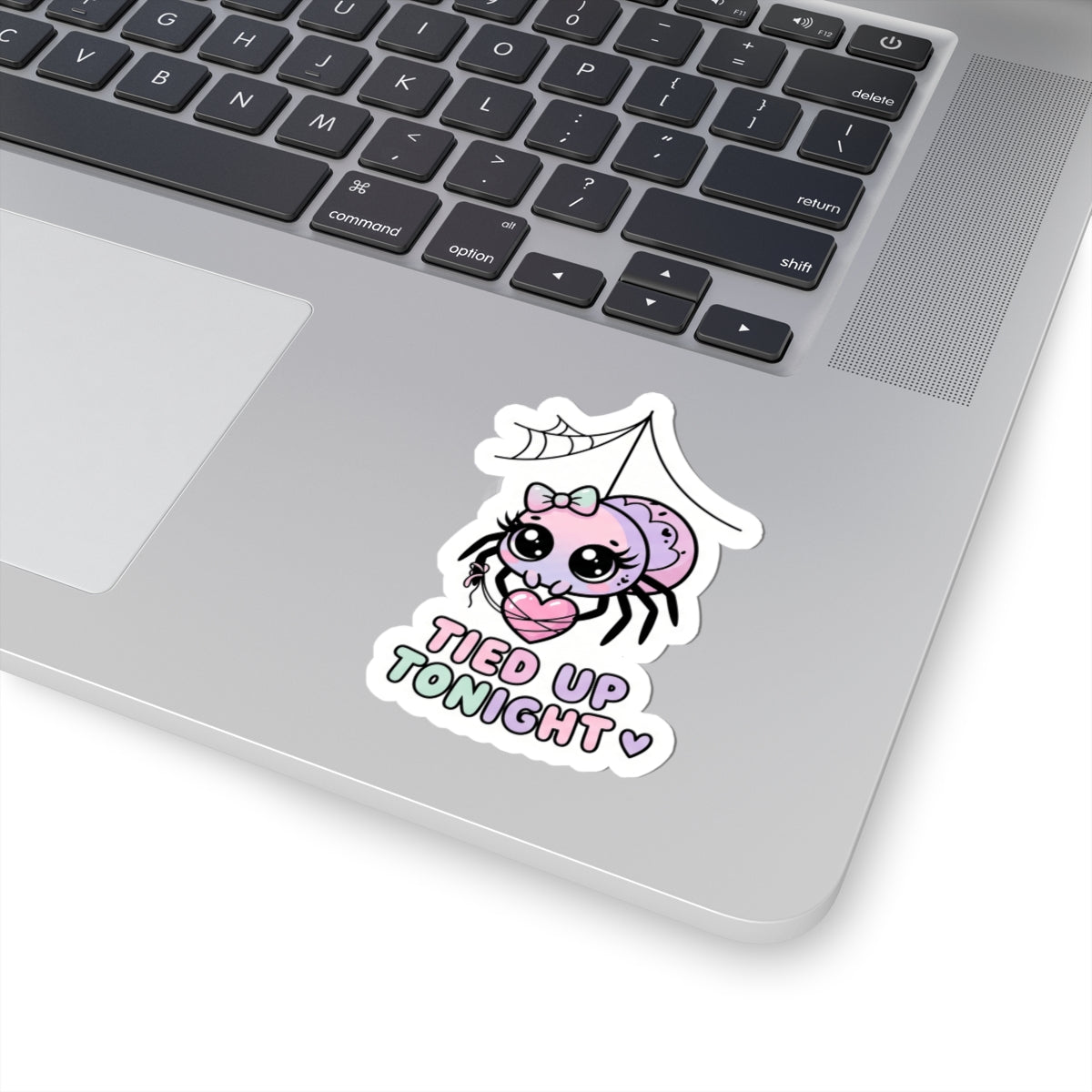 Kiss-cut sticker featuring a pink spider character with bow and heart, 'TIED UP TONIGHT'