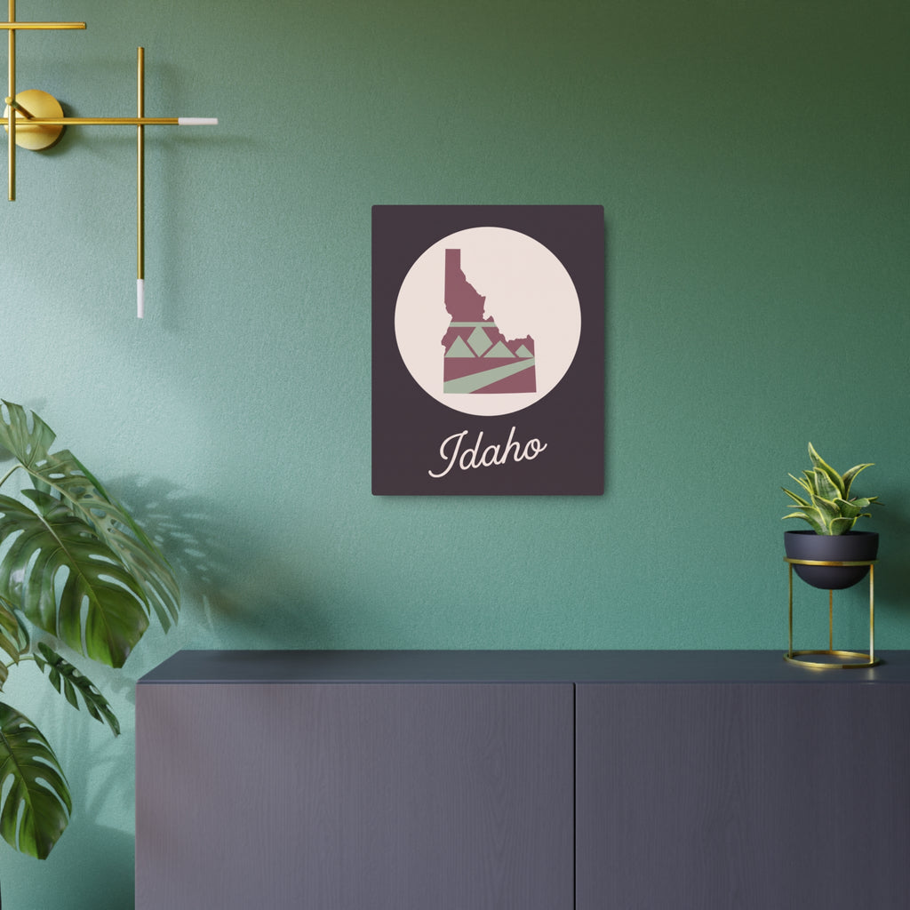 Idaho silhouette metal wall art, mauve state icon with Idaho script on dark square plaque