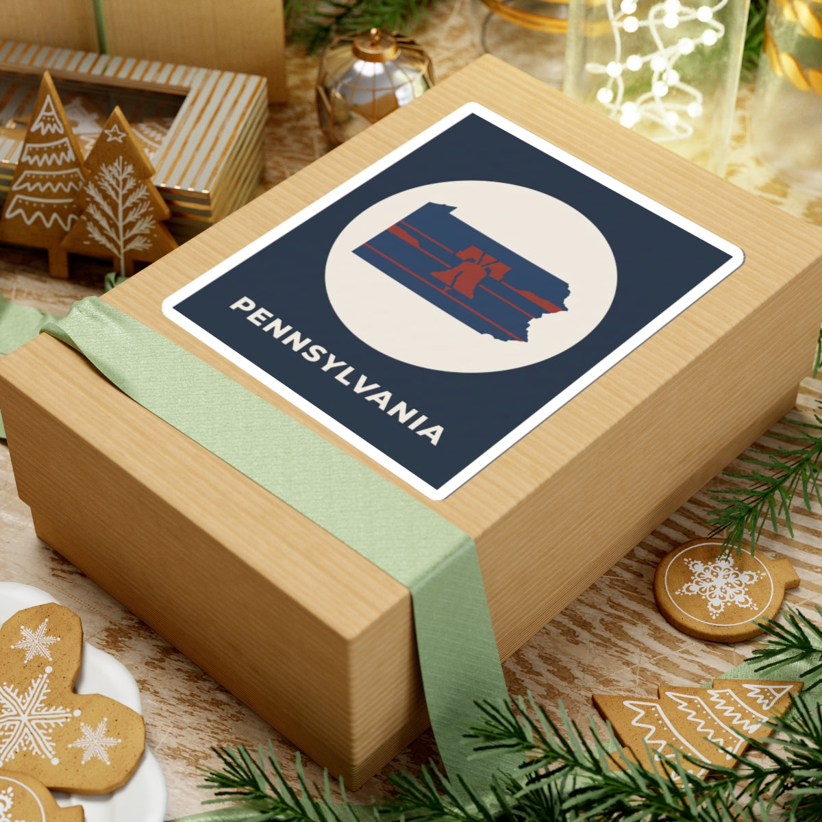 Navy square sticker on gift: white circle Pennsylvania map with Liberty Bell stripes, PENNSYLVANIA text