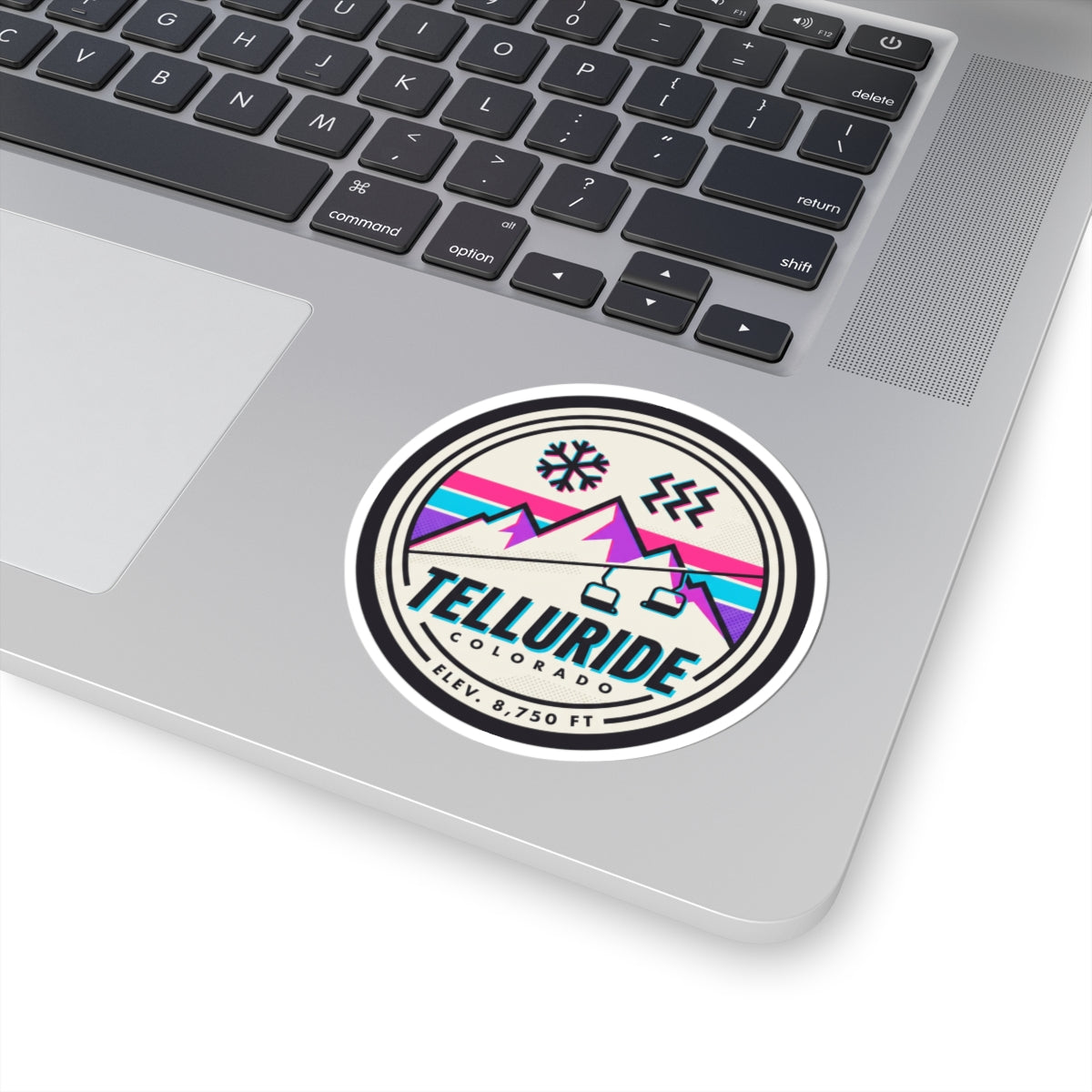 Circular Telluride Colorado ski lift sticker with black double-ring border and snowflake