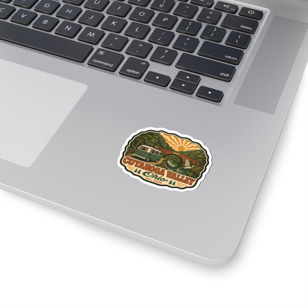 Oval kiss-cut scenic park sticker, multicolor vintage camper and river bridge