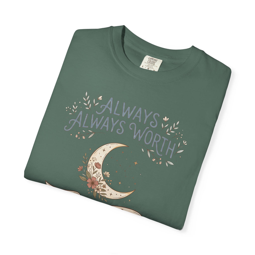 T-shirt in deep green with moon and “ALWAYS WORTH” floral text graphic on front.