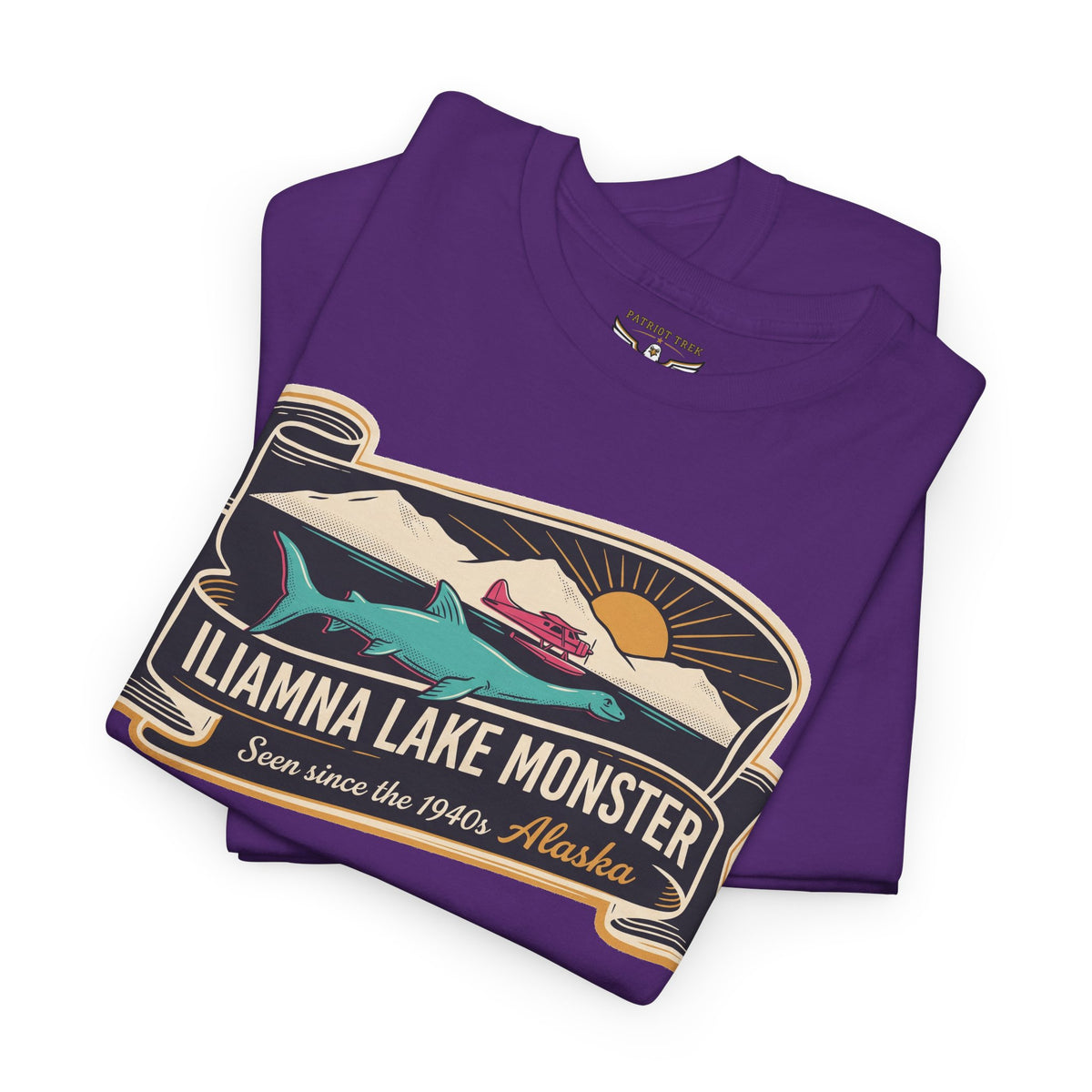 Purple crewneck tee with close-up retro lake monster badge graphic on front