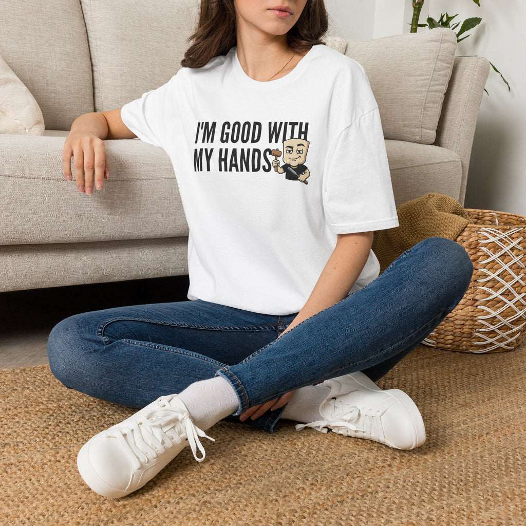 White T-shirt with “I’m good with my hands” carpenter graphic, worn by model