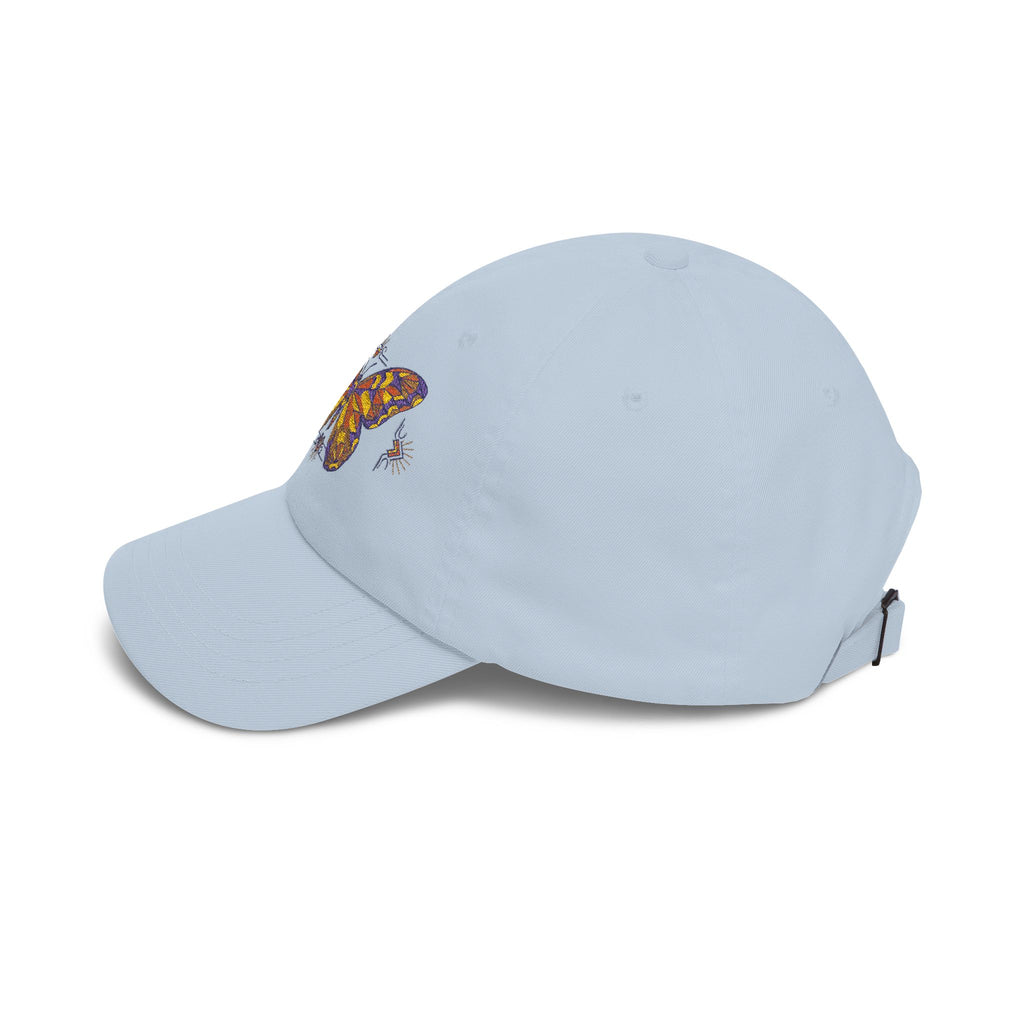 Embroidered dad cap in light blue with colorful butterfly/moth patch on front