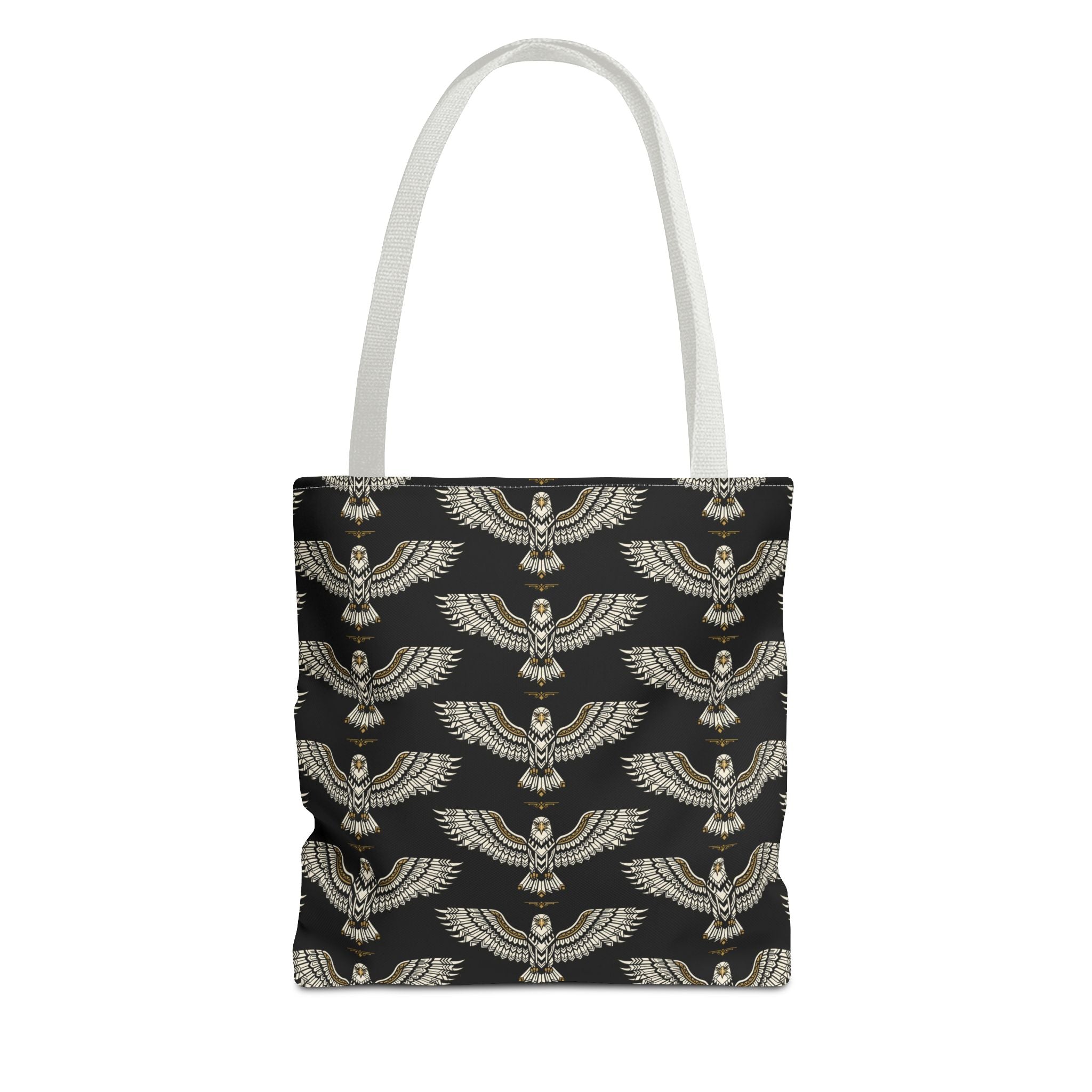 Tote bag with black fabric and repeating gold winged scarab pattern, white handles