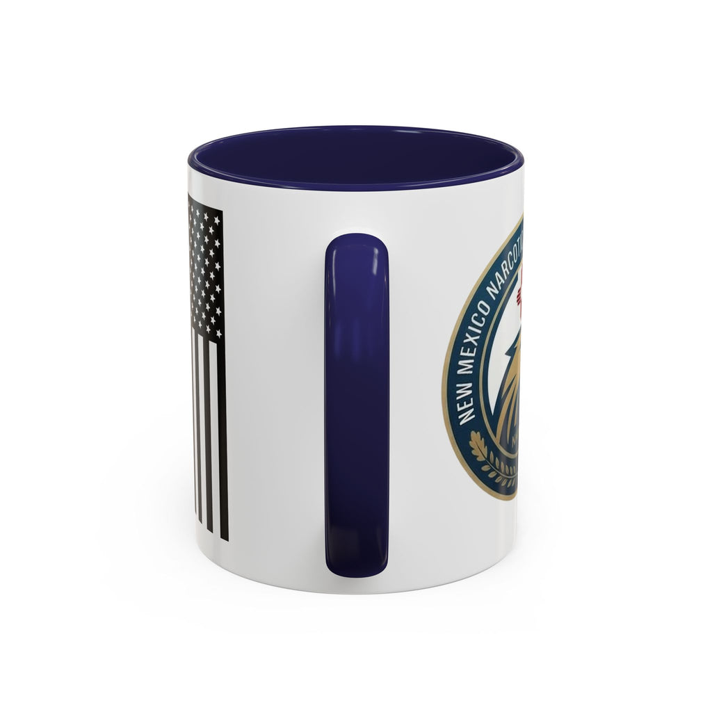 White coffee mug with navy rim, showing vertical navy U-shaped graphic and side NMNOA emblem.