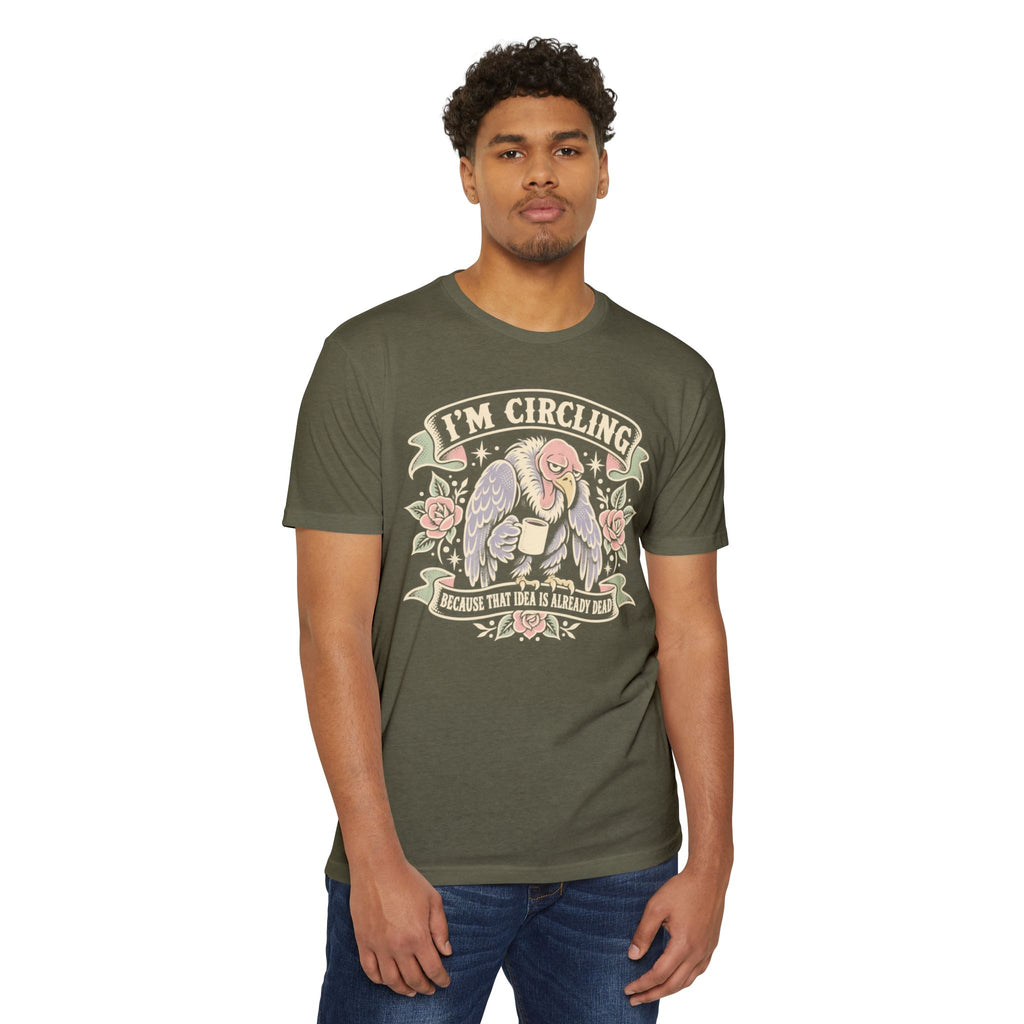 Olive green graphic t-shirt with 'I'm circling' angel/vulture front graphic