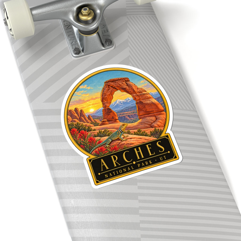 Round kiss-cut vinyl sticker with Arches desert arch rocks, green lizard, and UT nameplate.