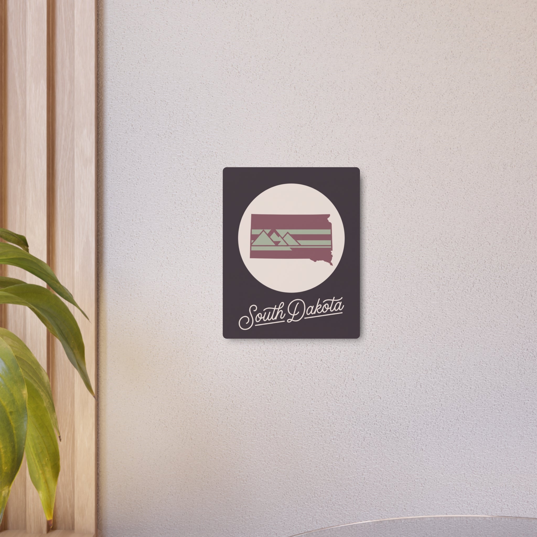 Square metal wall art sign with South Dakota graphic and script on a dark mauve panel