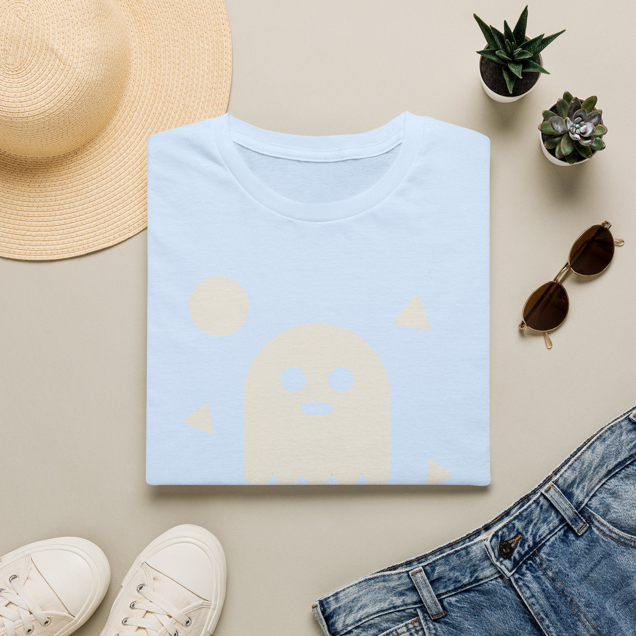 Light blue T-shirt with pale ghost face graphic and small triangle accents