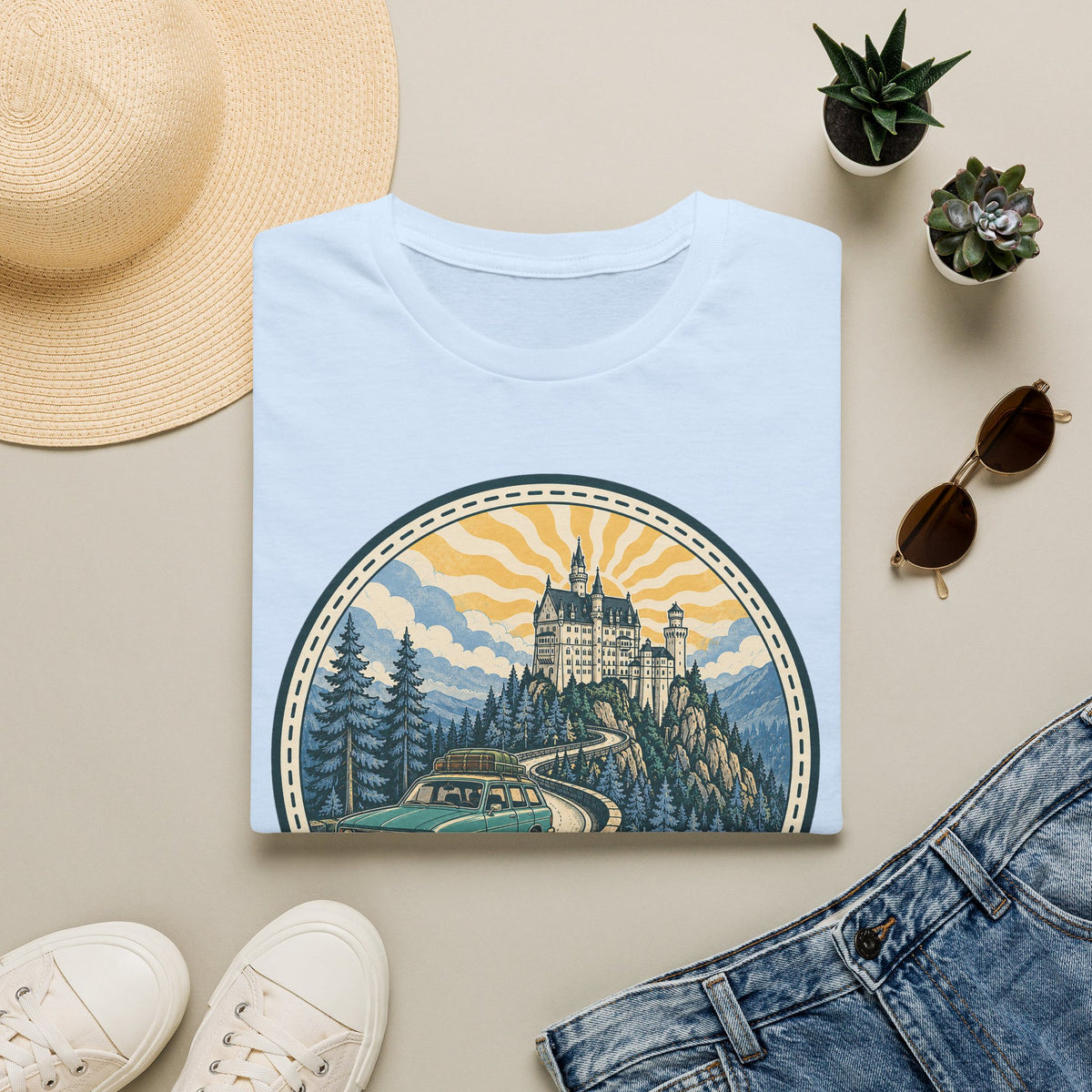 Light blue T-shirt with circular castle landscape illustration graphic