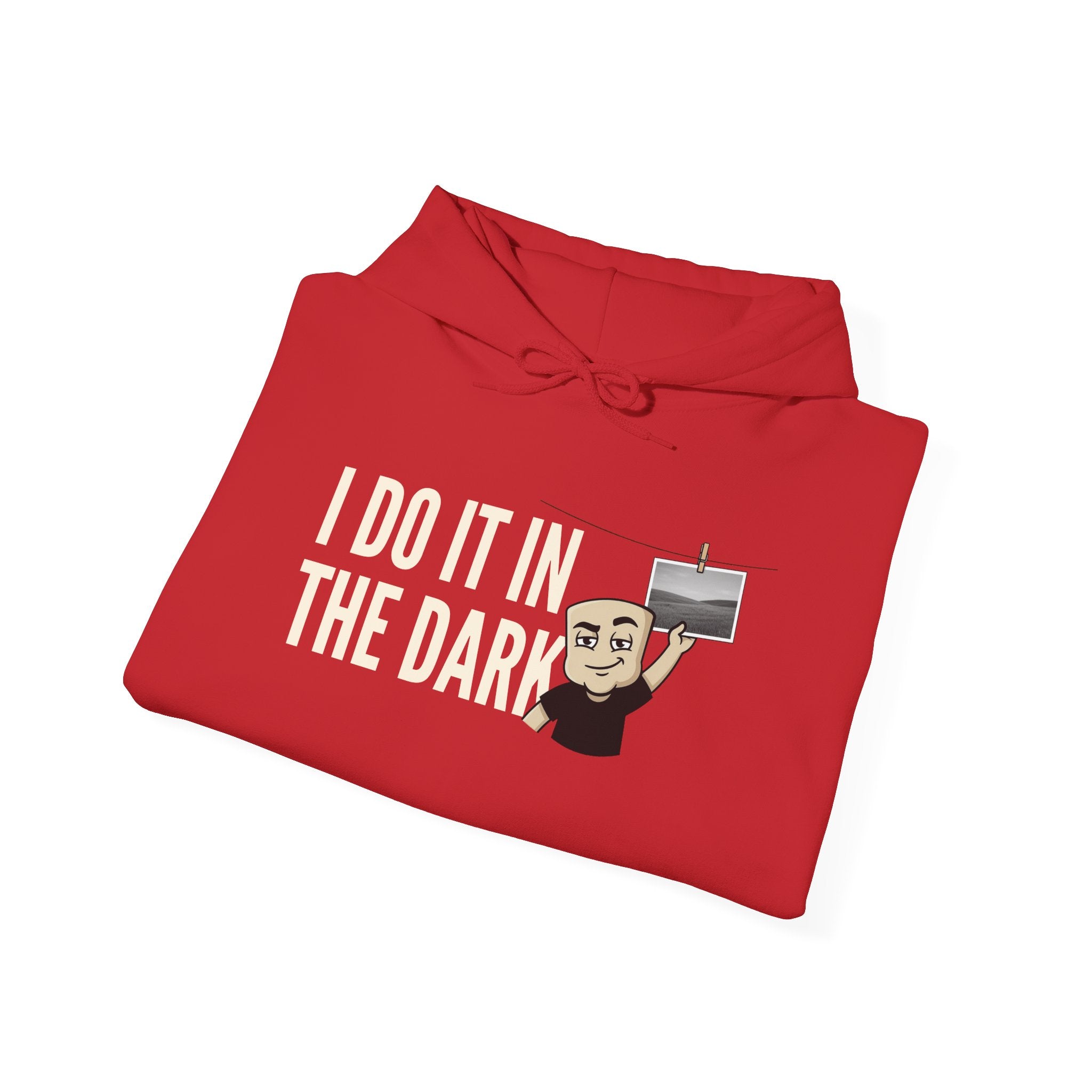Red pullover hoodie with drawstring hood and 'I do it in the dark' graphic