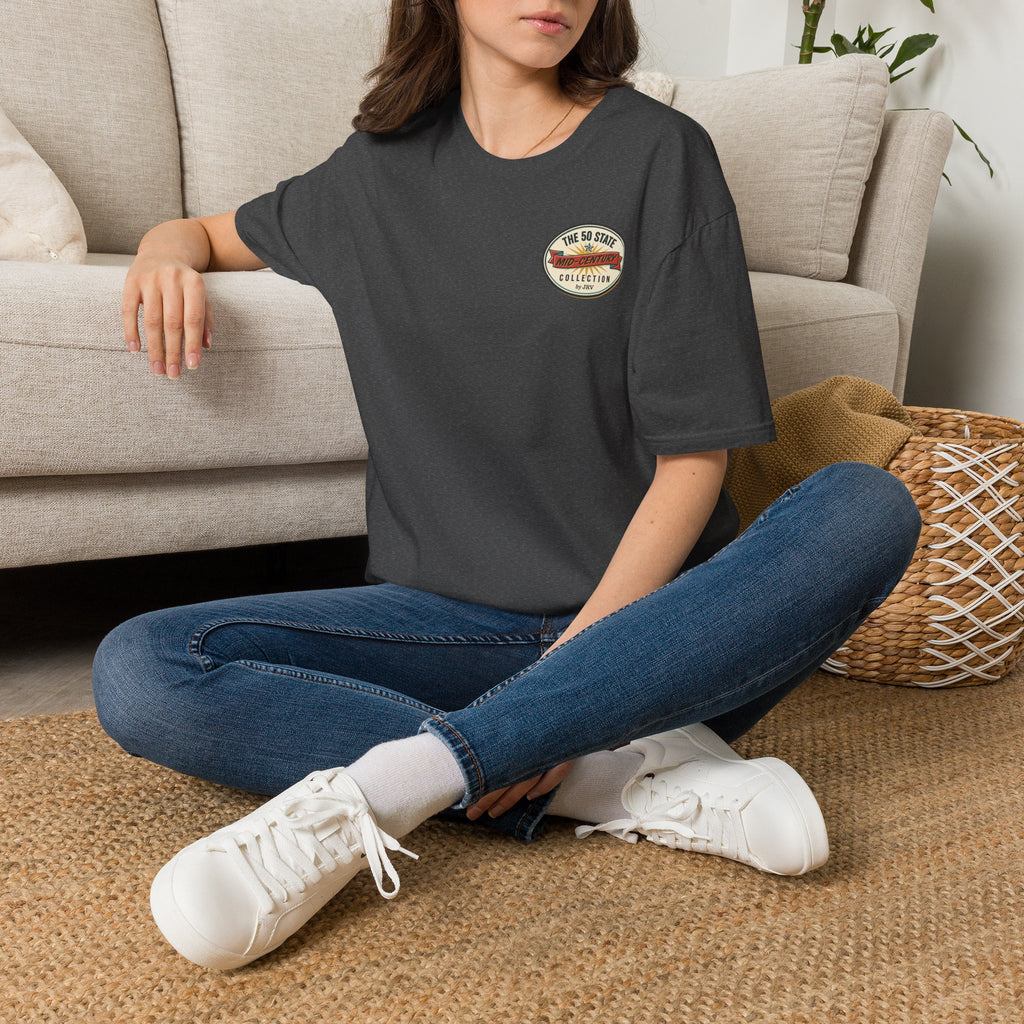 Charcoal gray T-shirt with round chest logo patch.