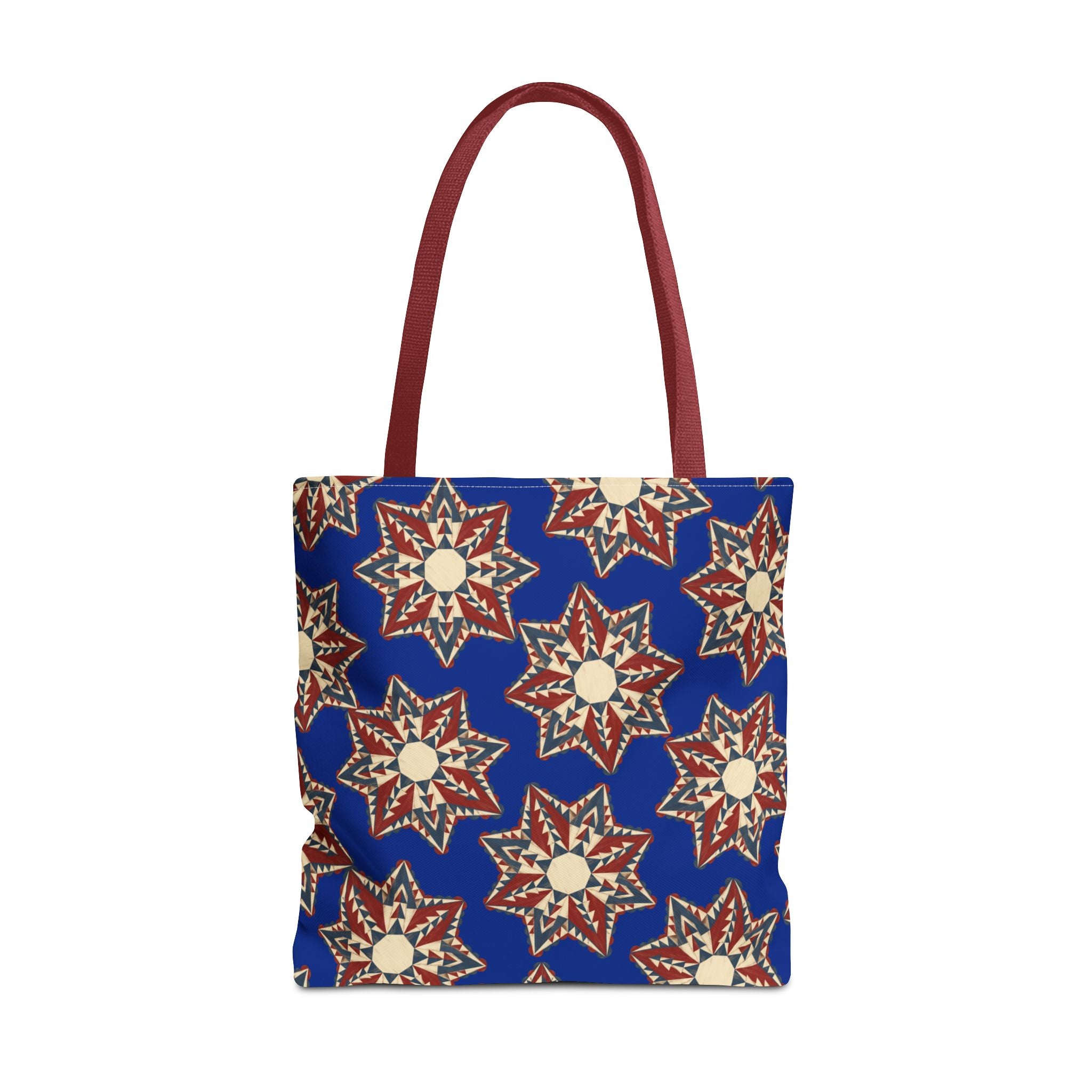 Blue tote bag with starburst floral pattern and maroon handles