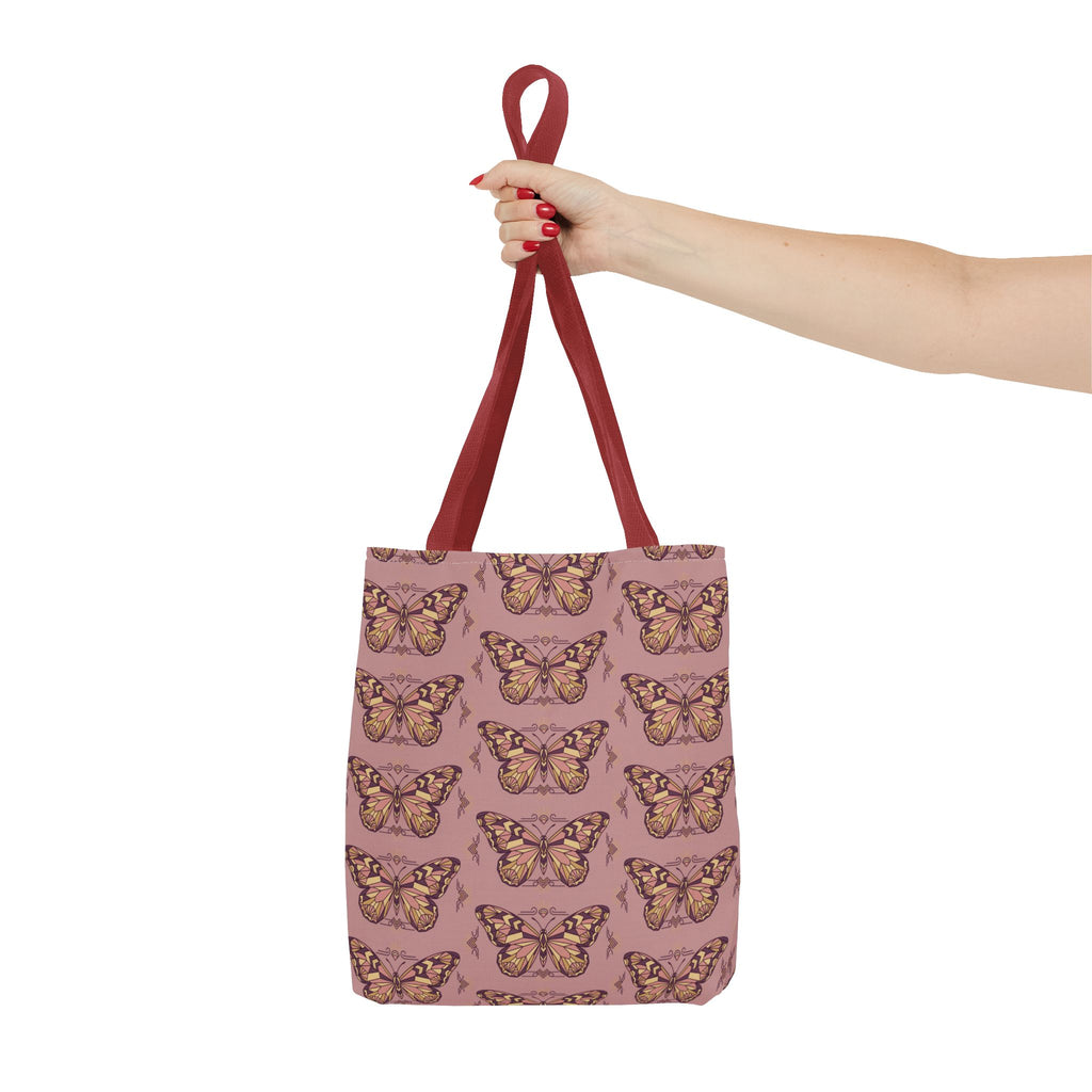 Butterfly-pattern tote bag in pink with brown-red handles, shown front view