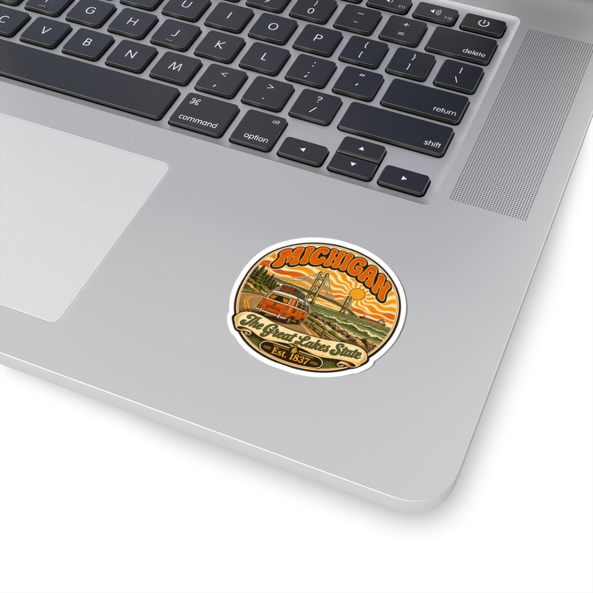 Round Michigan Great Lakes state sticker with vintage seal design, orange and green scenery