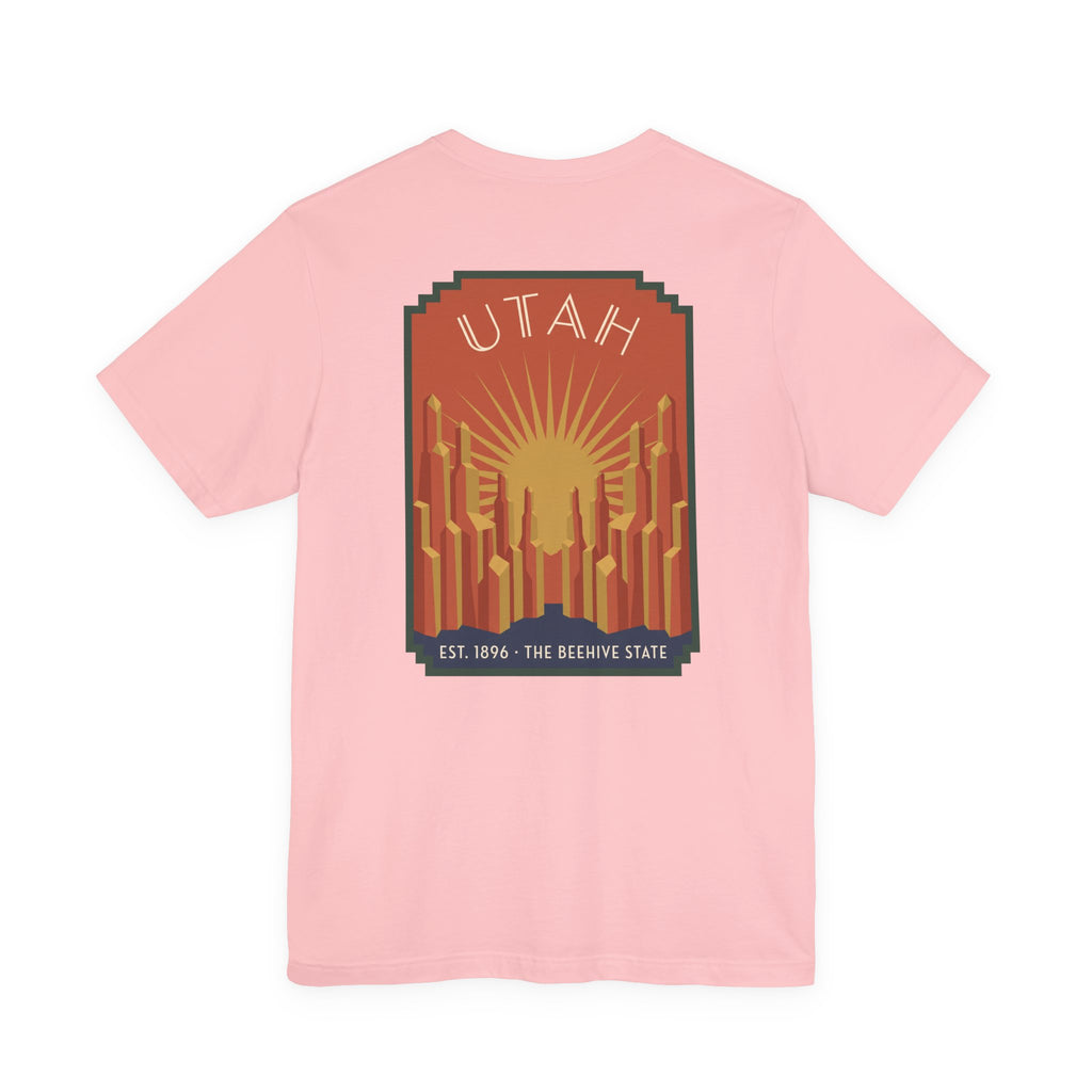 Light pink t-shirt with square art deco Utah skyline sunrise graphic on chest