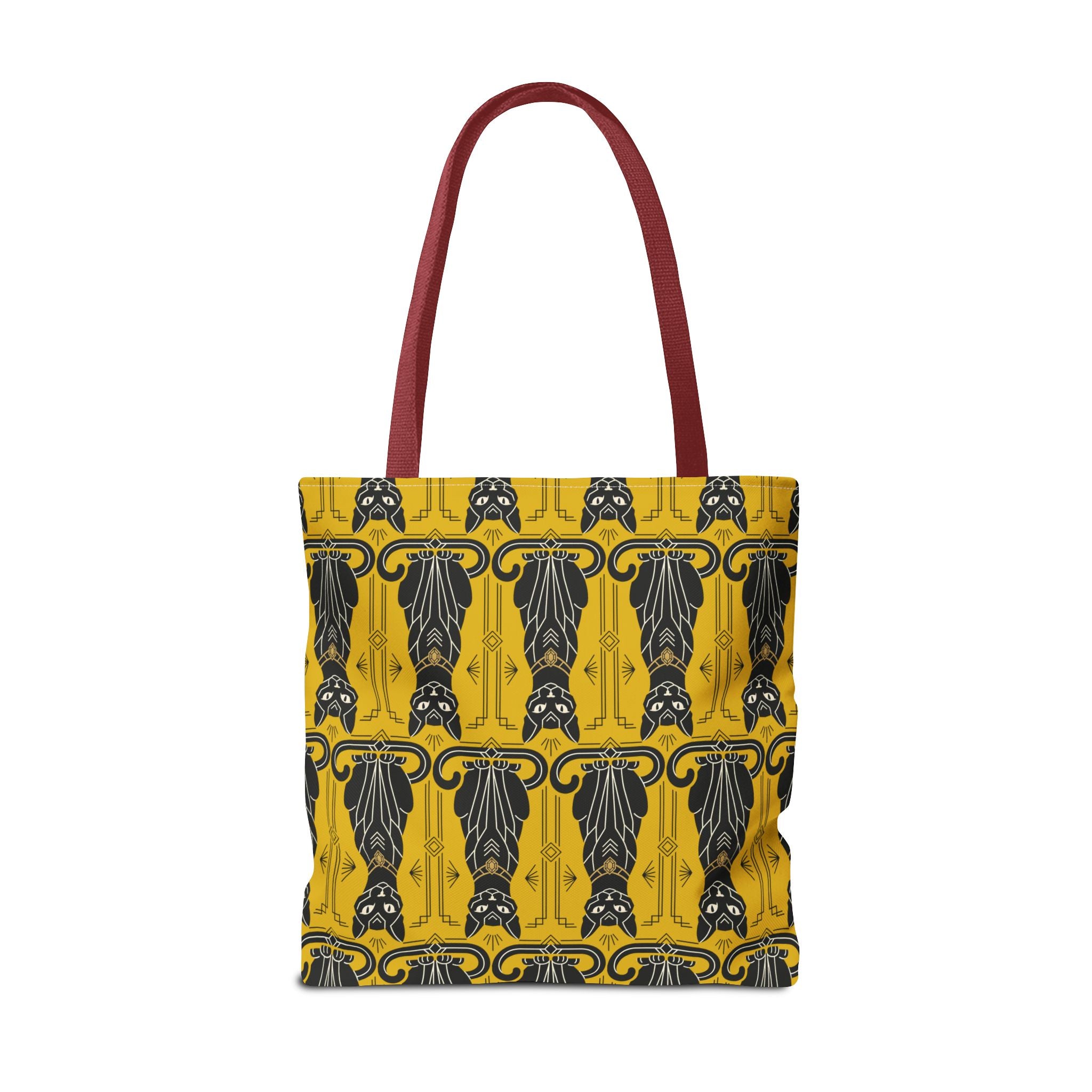 Yellow tote bag with repeating black cat pattern and navy swirls, red-brown handles.